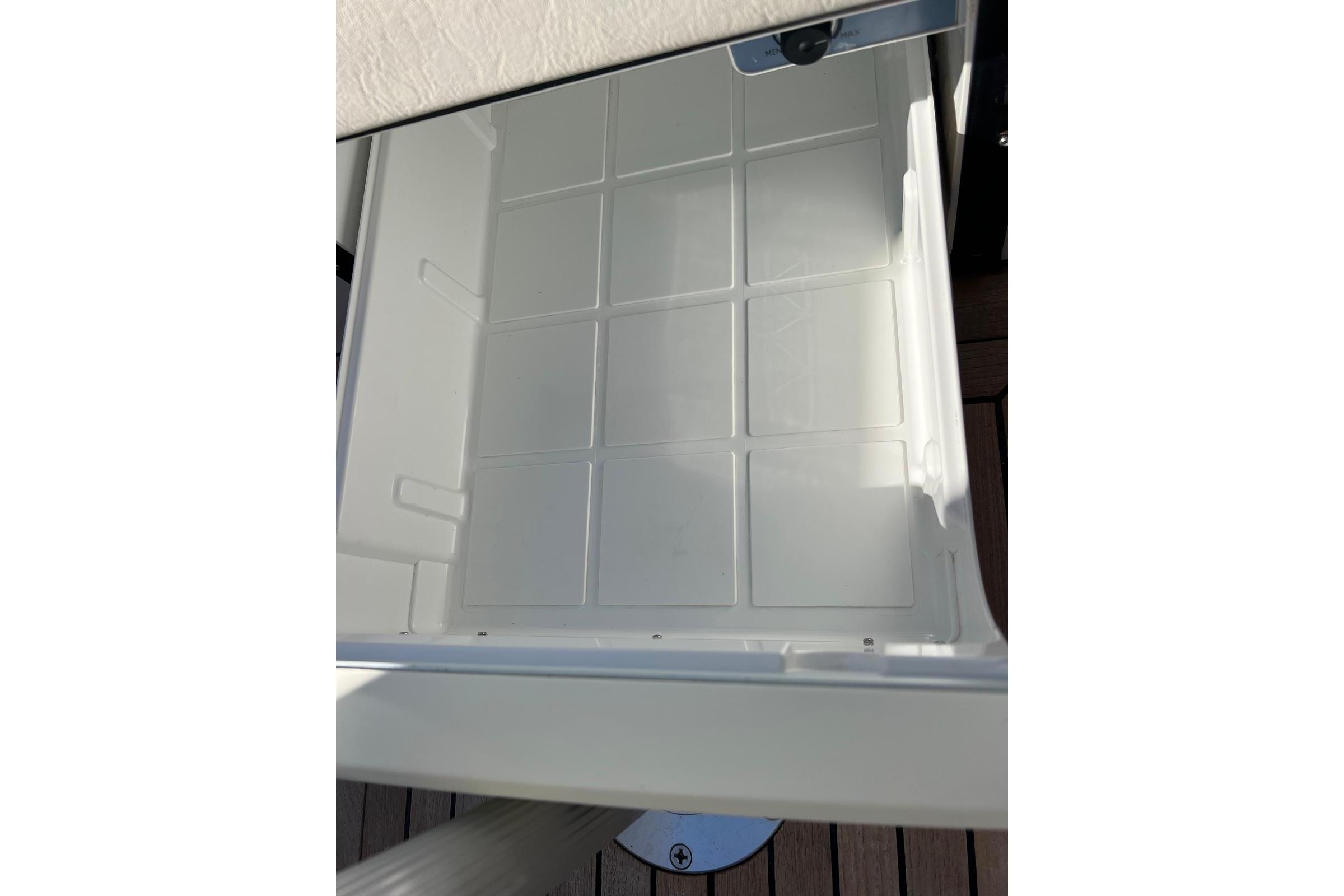 Storage compartment of 2021 Frauscher 858 Fantom boat, featuring a sleek, white interior design.