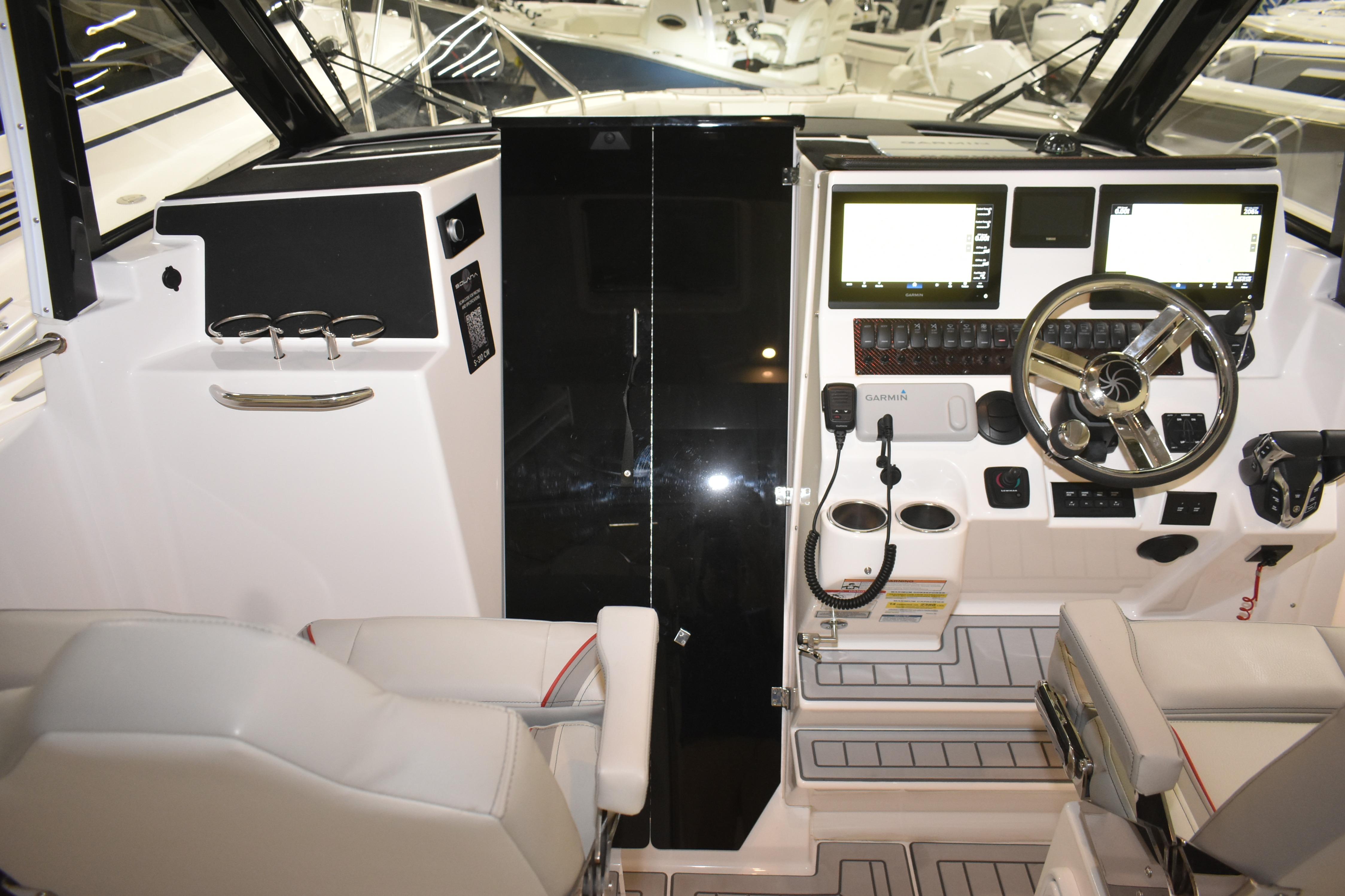 2025 Solara S-310 CW boat cockpit with modern controls and navigation displays.