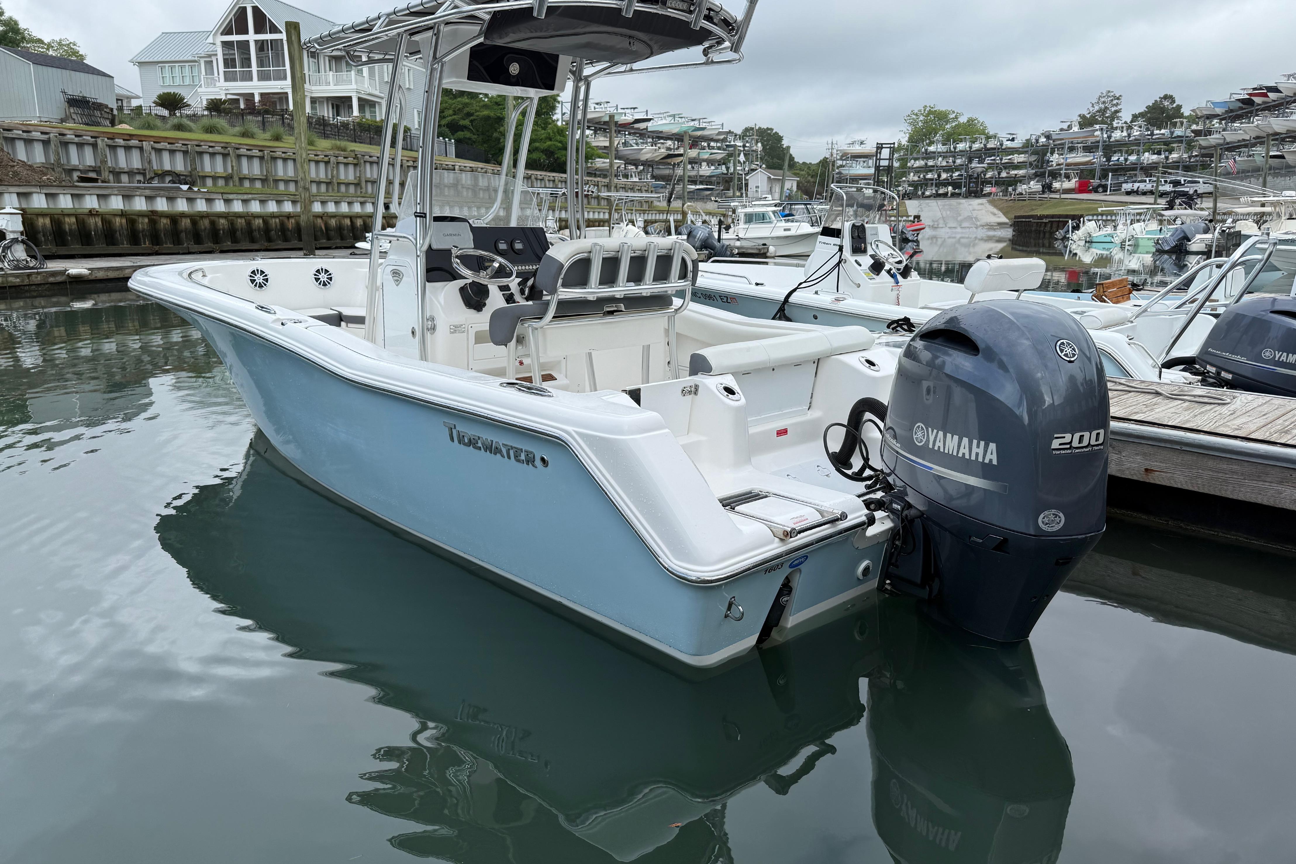 2017 Tidewater 220 CC Adventure boat docked with Yamaha 200 engine.