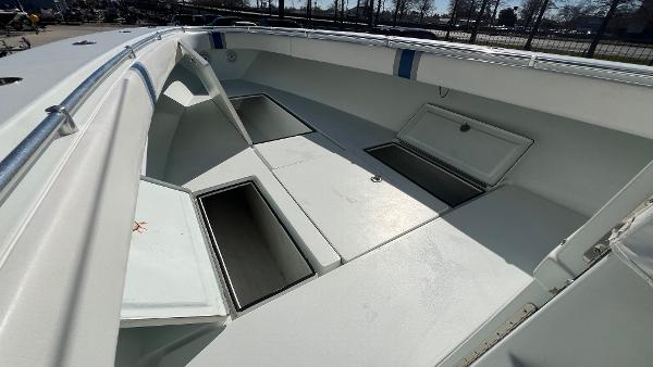 2005 Contender 36 Open boat with open storage compartments.