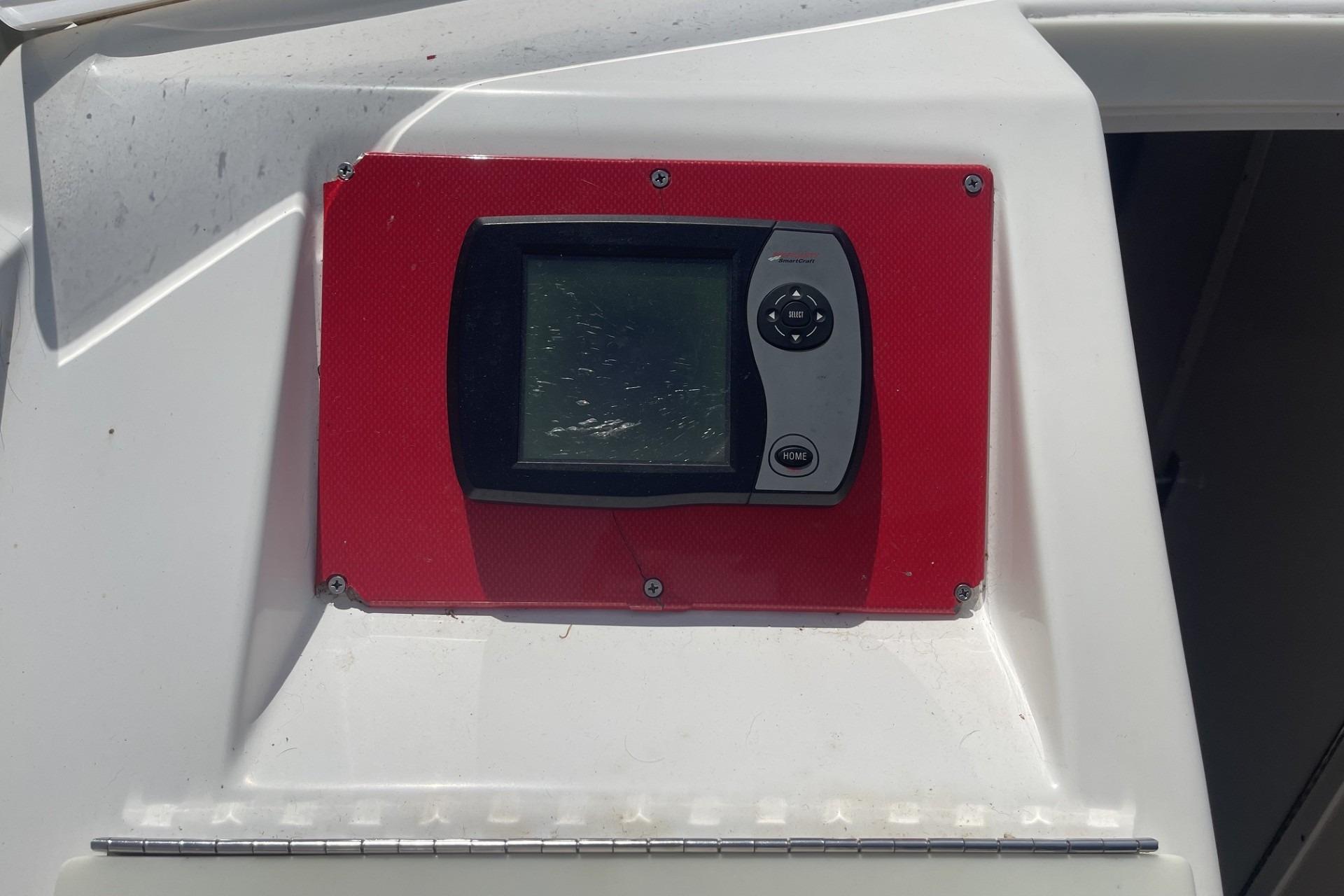 Control panel on a 2006 Sonic 386 boat, mounted on a red background.