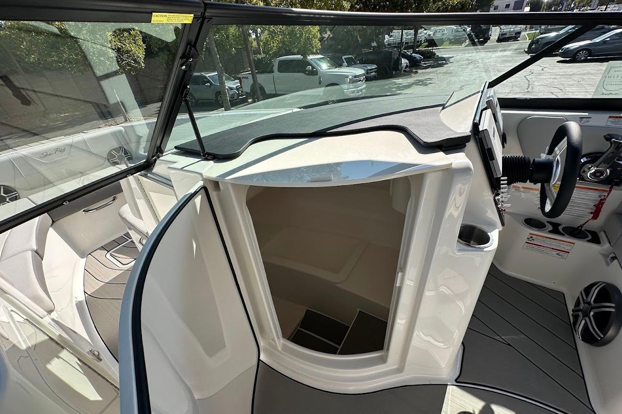 2026 Sea Ray SDX 230 Surf boat interior with helm and seating area.