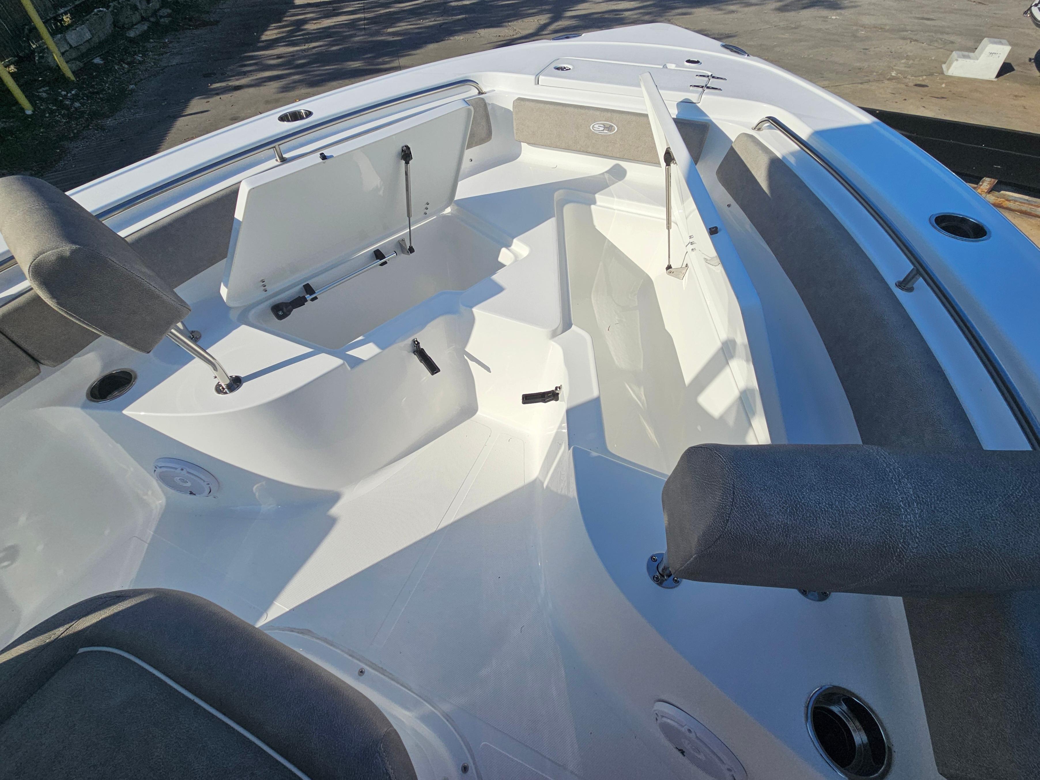 2025 Sea Hunt Ultra 229 boat interior with seating and storage compartments.