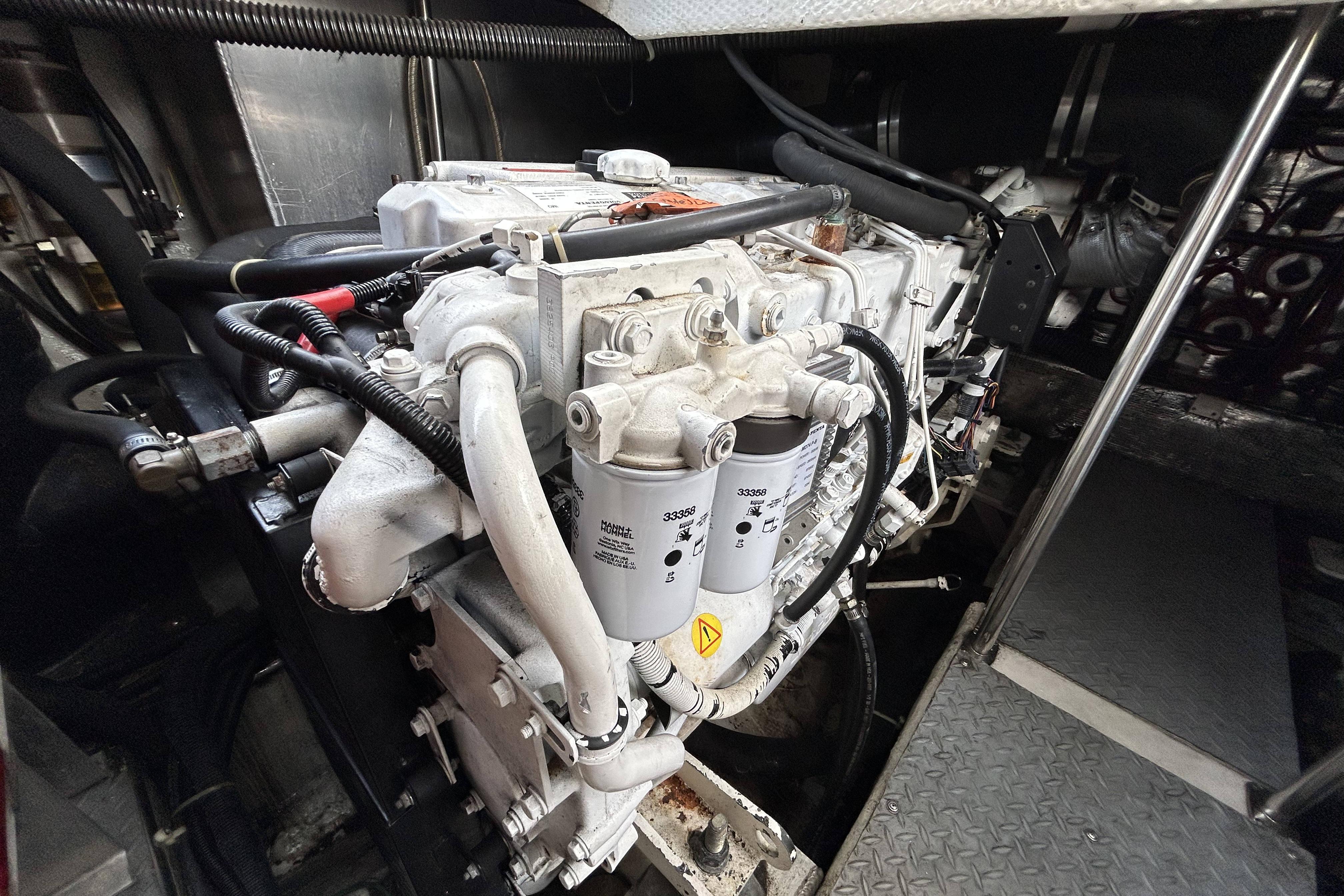 Engine compartment of a 2002 Regal Commodore 4260 boat, showcasing mechanical components.