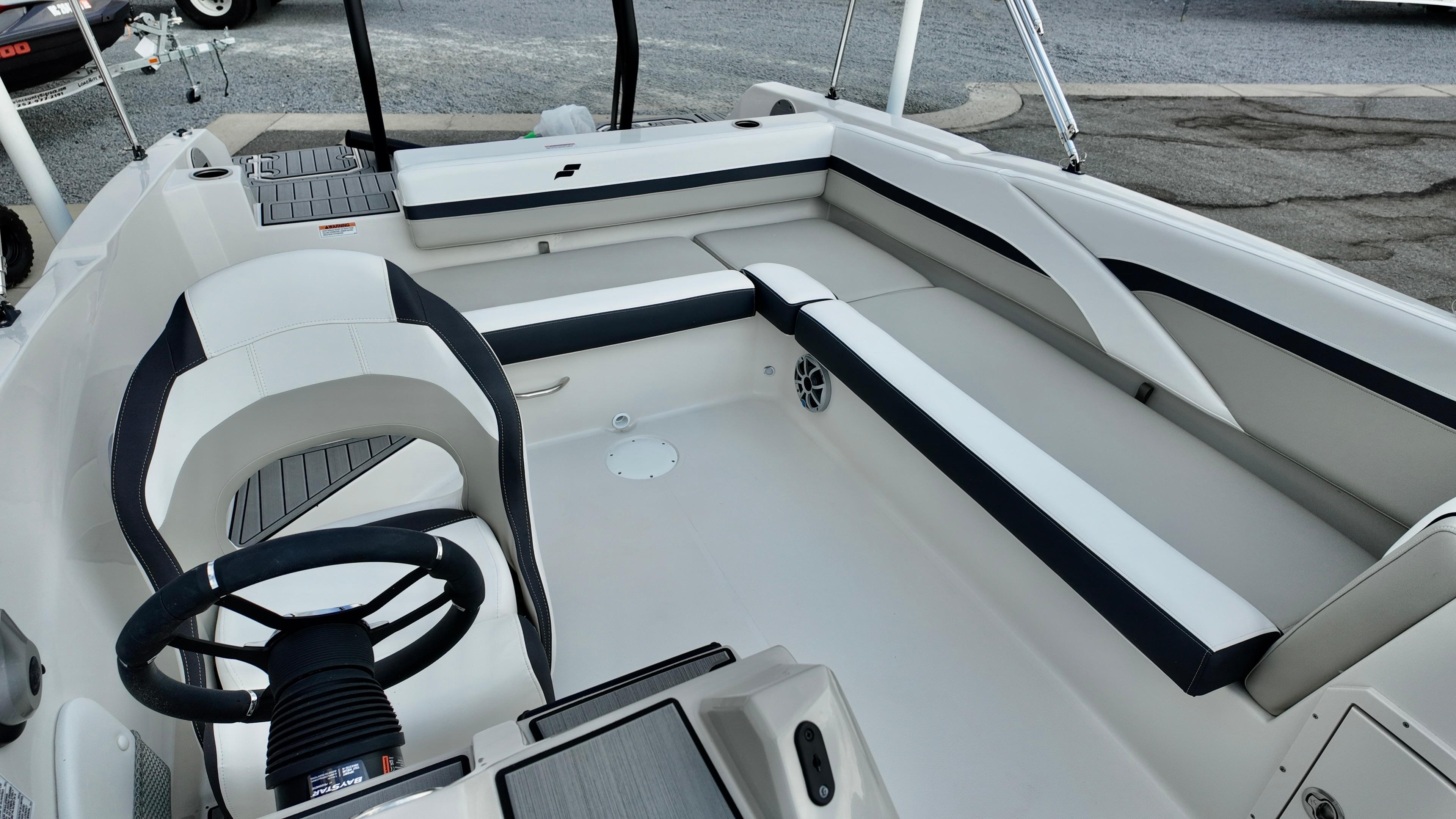 2026 Starcraft SVX 211 OB boat interior with sleek seating and modern steering wheel.