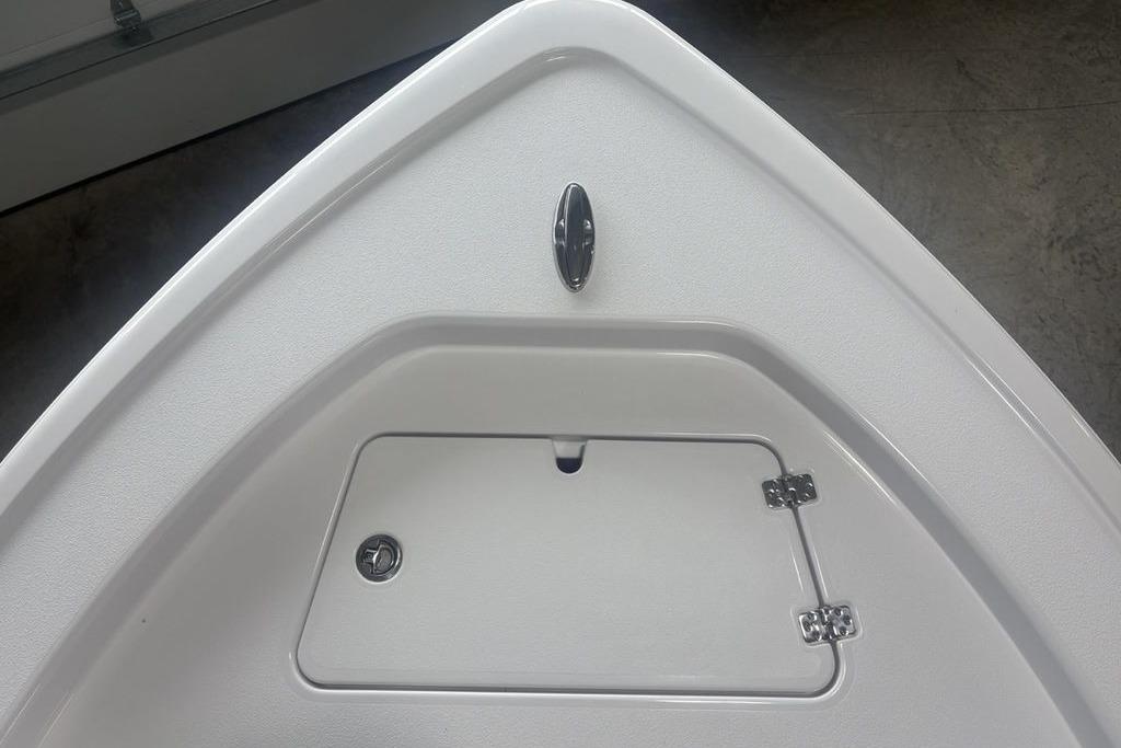 Bow of 2026 Sportsman Masters 227 boat with storage compartment.