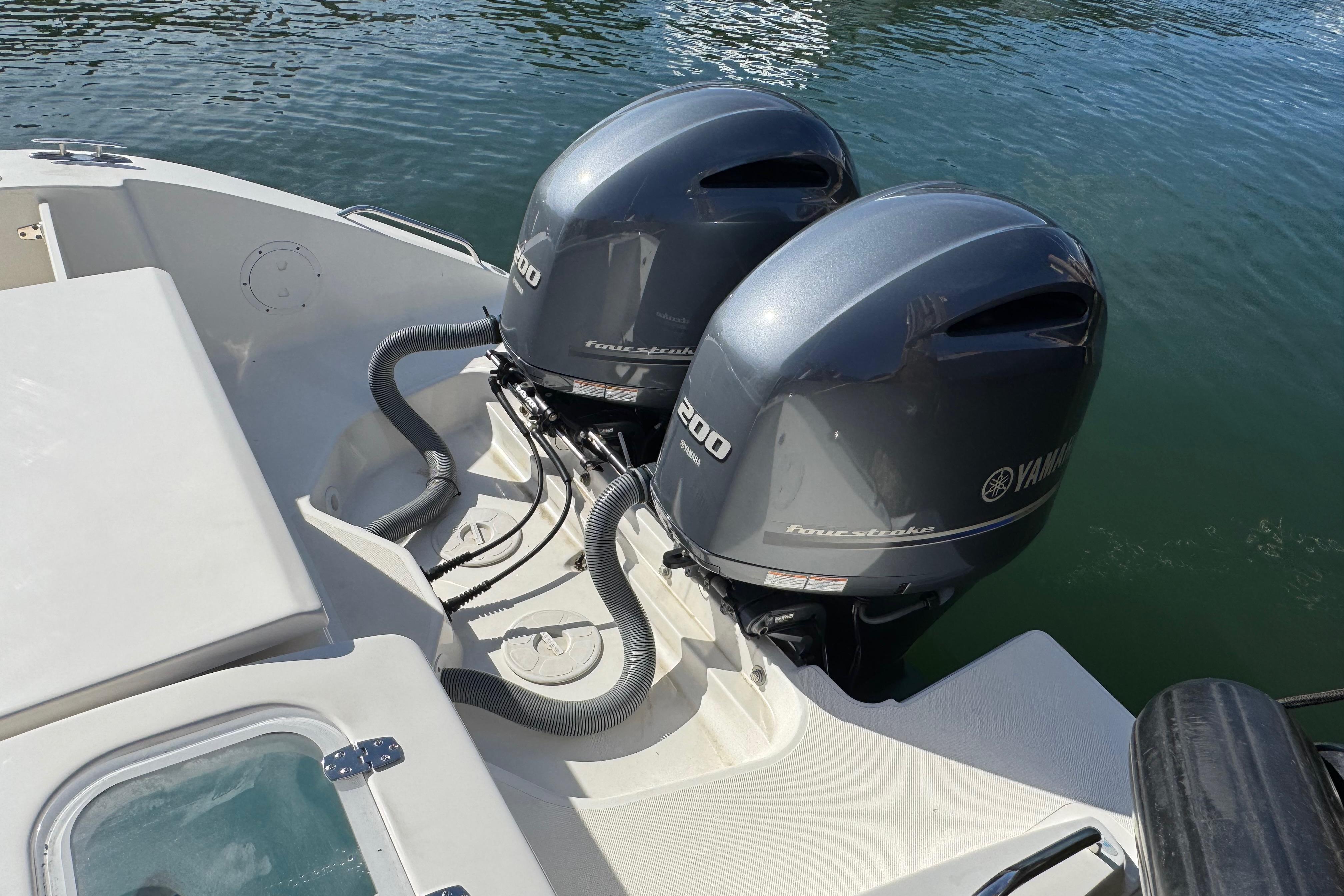 2022 Pursuit DC 266 Dual Console with twin Yamaha outboard engines on water.
