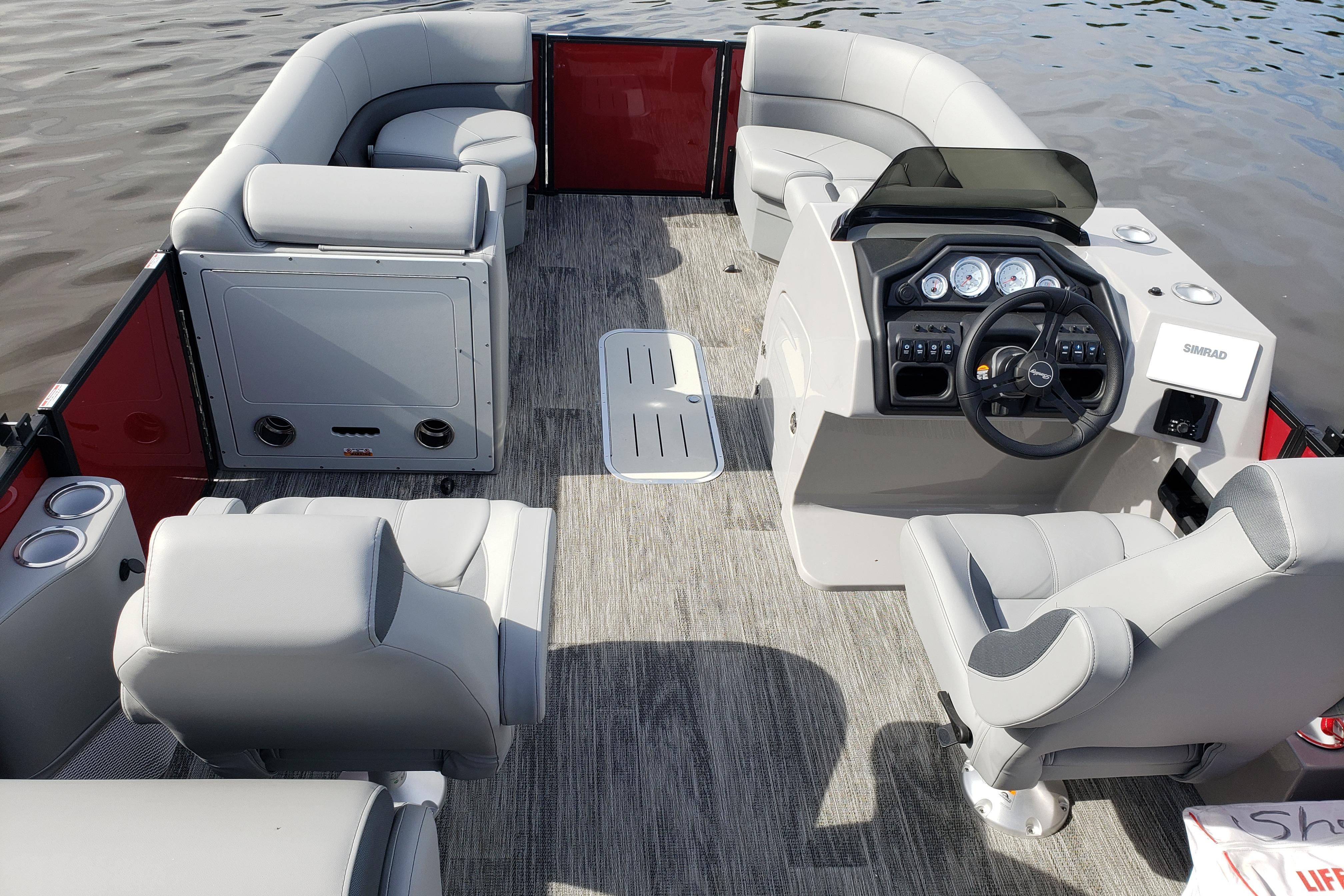 2026 Bentley Pontoons Legacy 243 Navigator Ext interior with modern seating and control panel.