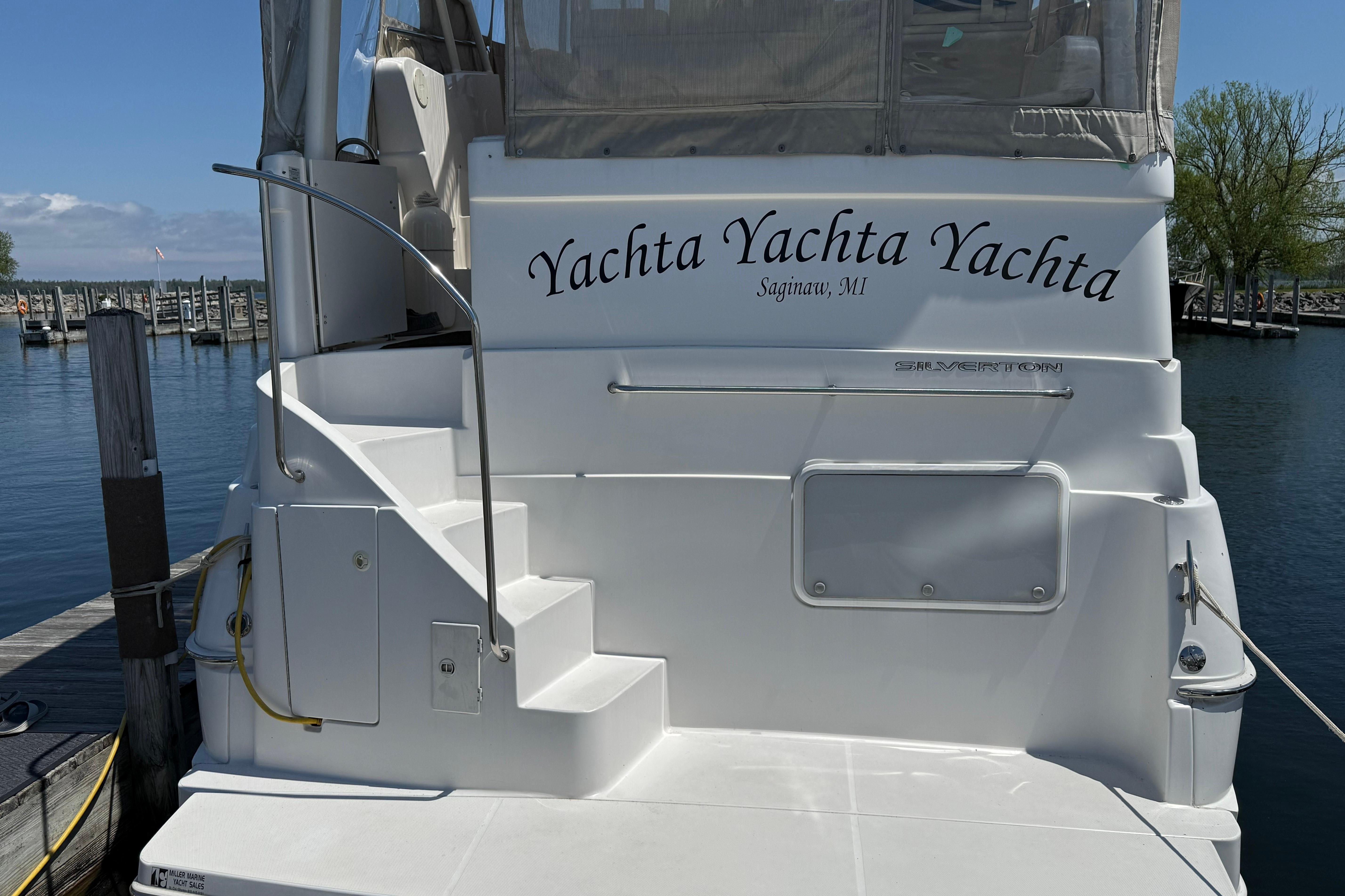 1999 Silverton 322 Motor Yacht docked, featuring "Yachta Yachta Yachta" name, Saginaw, MI.