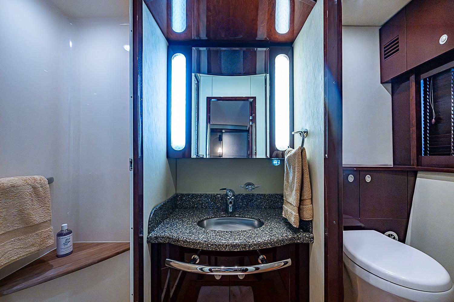 Luxurious bathroom interior of 2008 Sea Ray 60 Sundancer yacht with modern fixtures.