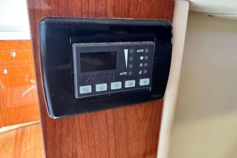 Control panel on 2009 Regal Commodore 4060 yacht, mounted on wooden interior.