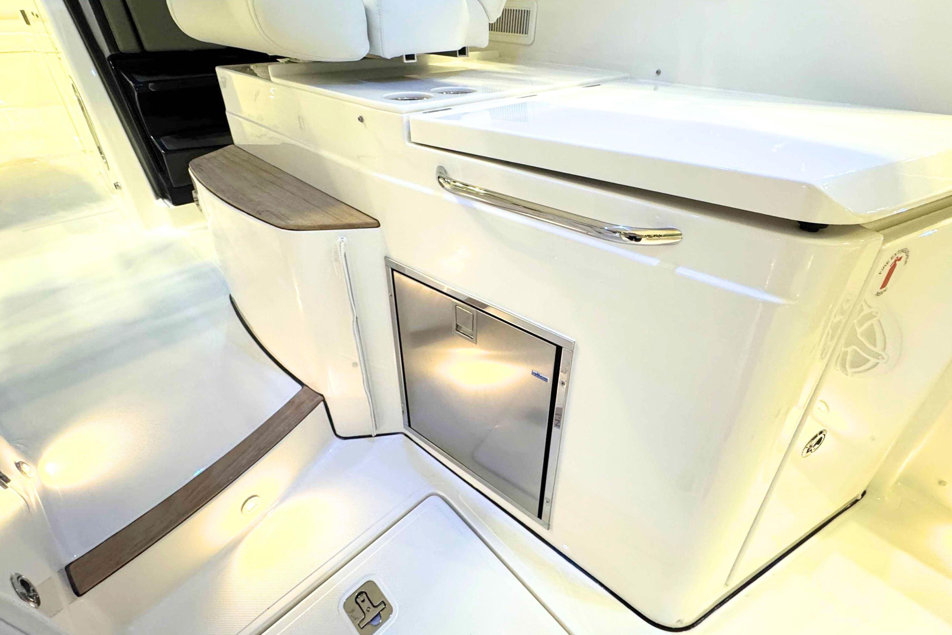2026 Pursuit DC 365 Dual Console interior with sleek cabinetry and modern design.