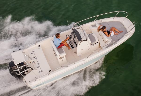 Manufacturer Provided Image: 2014 Boston Whaler 210 Dauntless boat cruising with two people onboard.