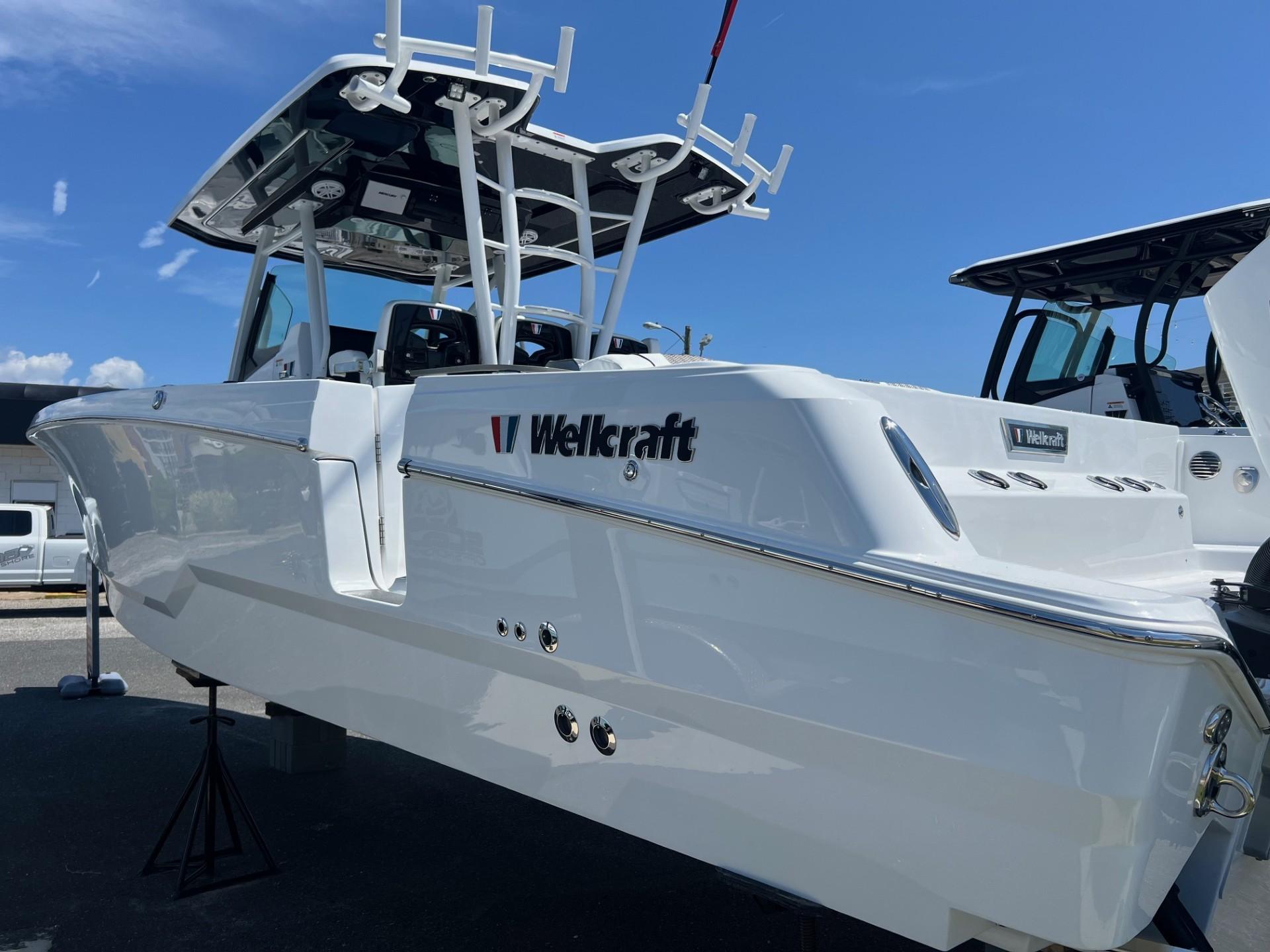 2025 Wellcraft 352 Fisherman boat displayed outdoors under clear blue sky.