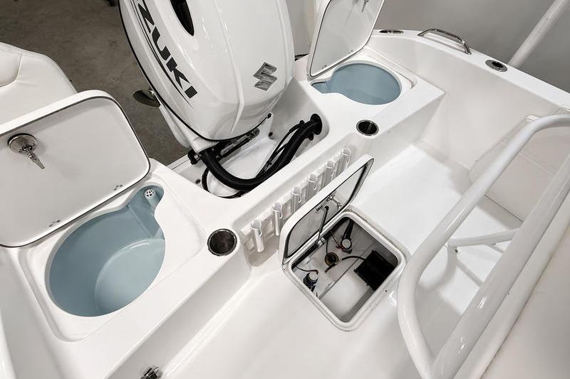 2026 Sea Pro 202 Center Console boat interior with Suzuki engine and storage compartments.
