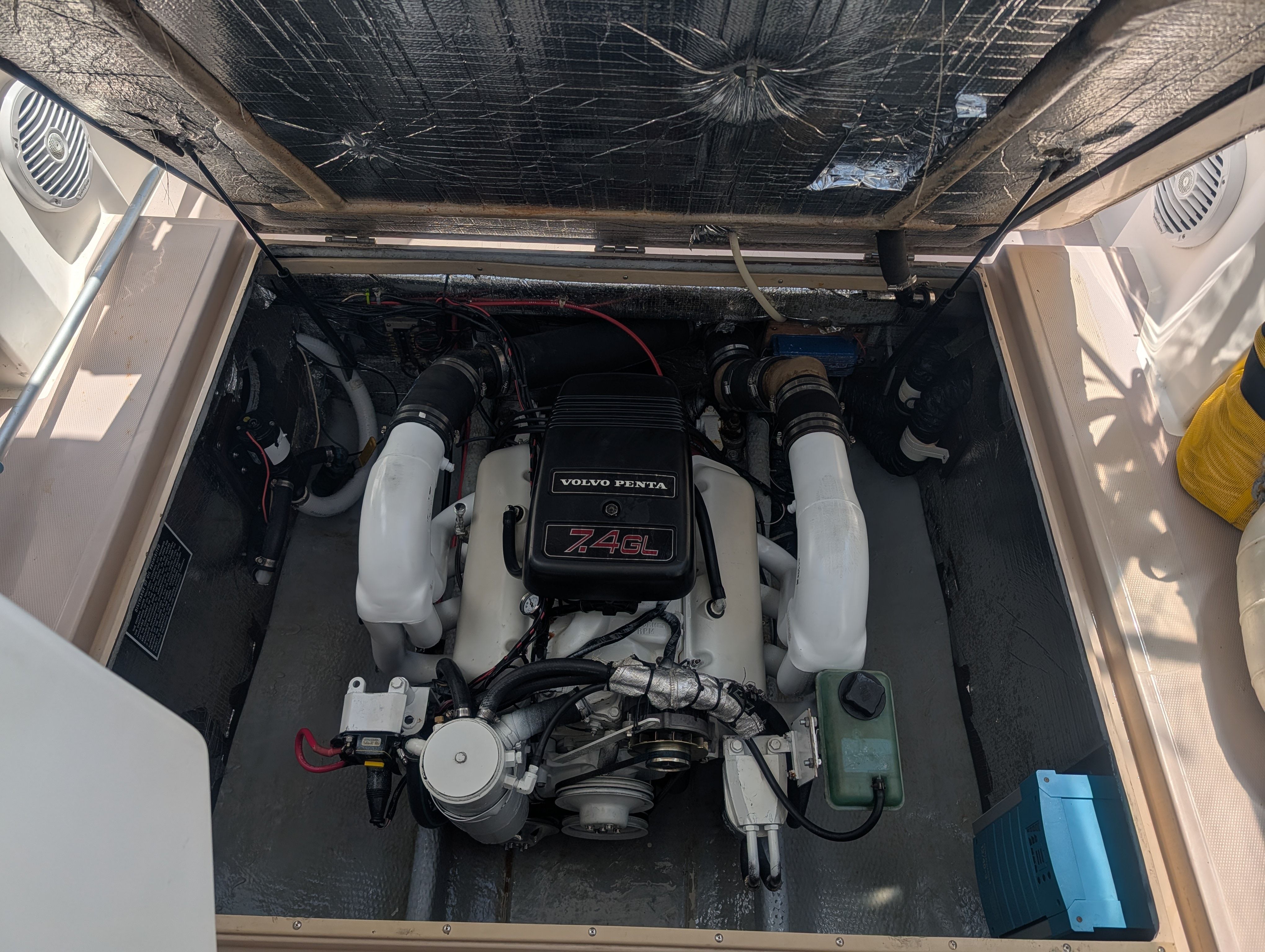 An open boat engine compartment with a Volvo Penta engine.