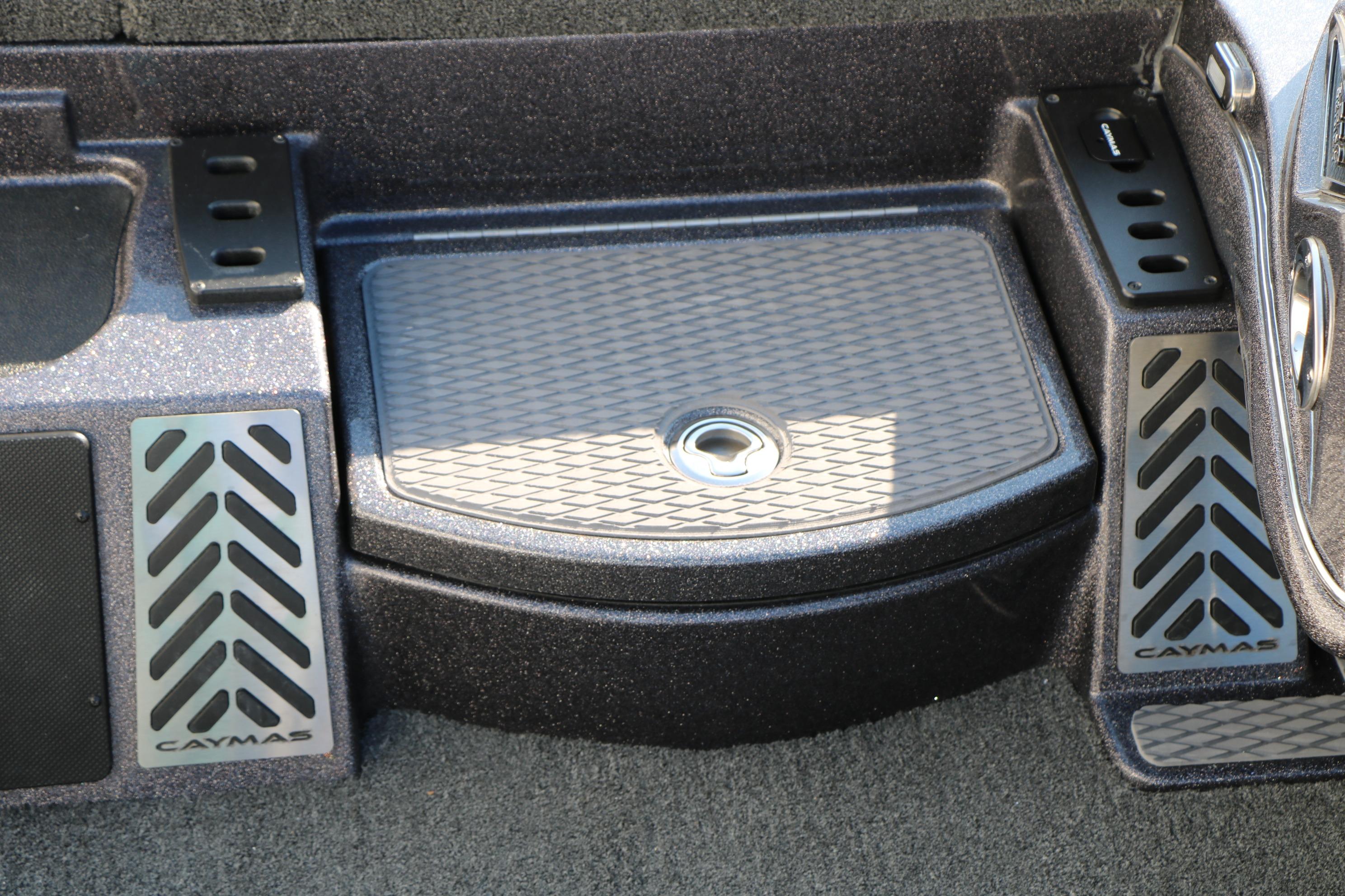 2027 Caymas 201 Pro boat interior with textured flooring and branded footrests.