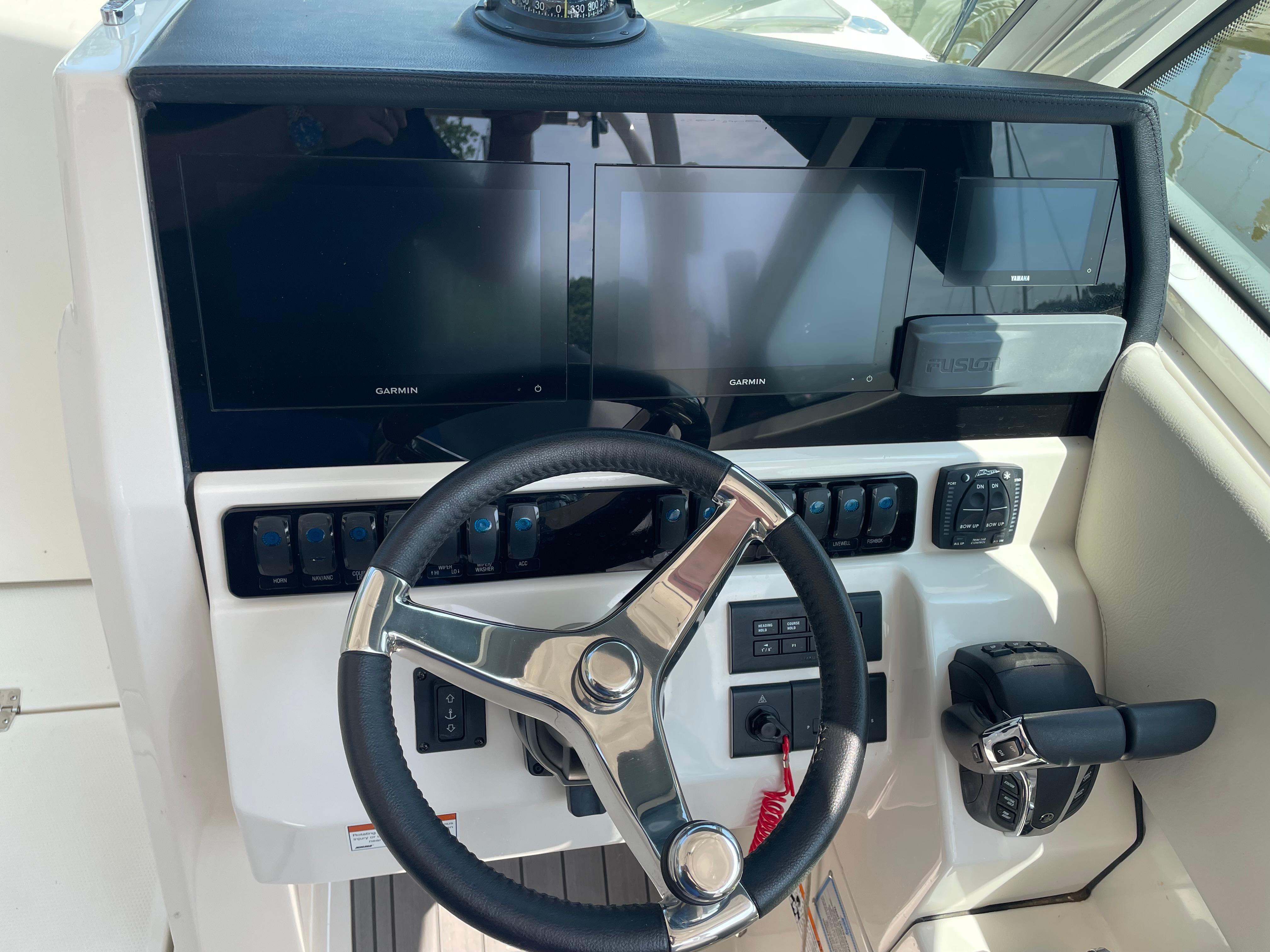 2023 Sailfish 276 DC helm with Garmin displays and controls.
