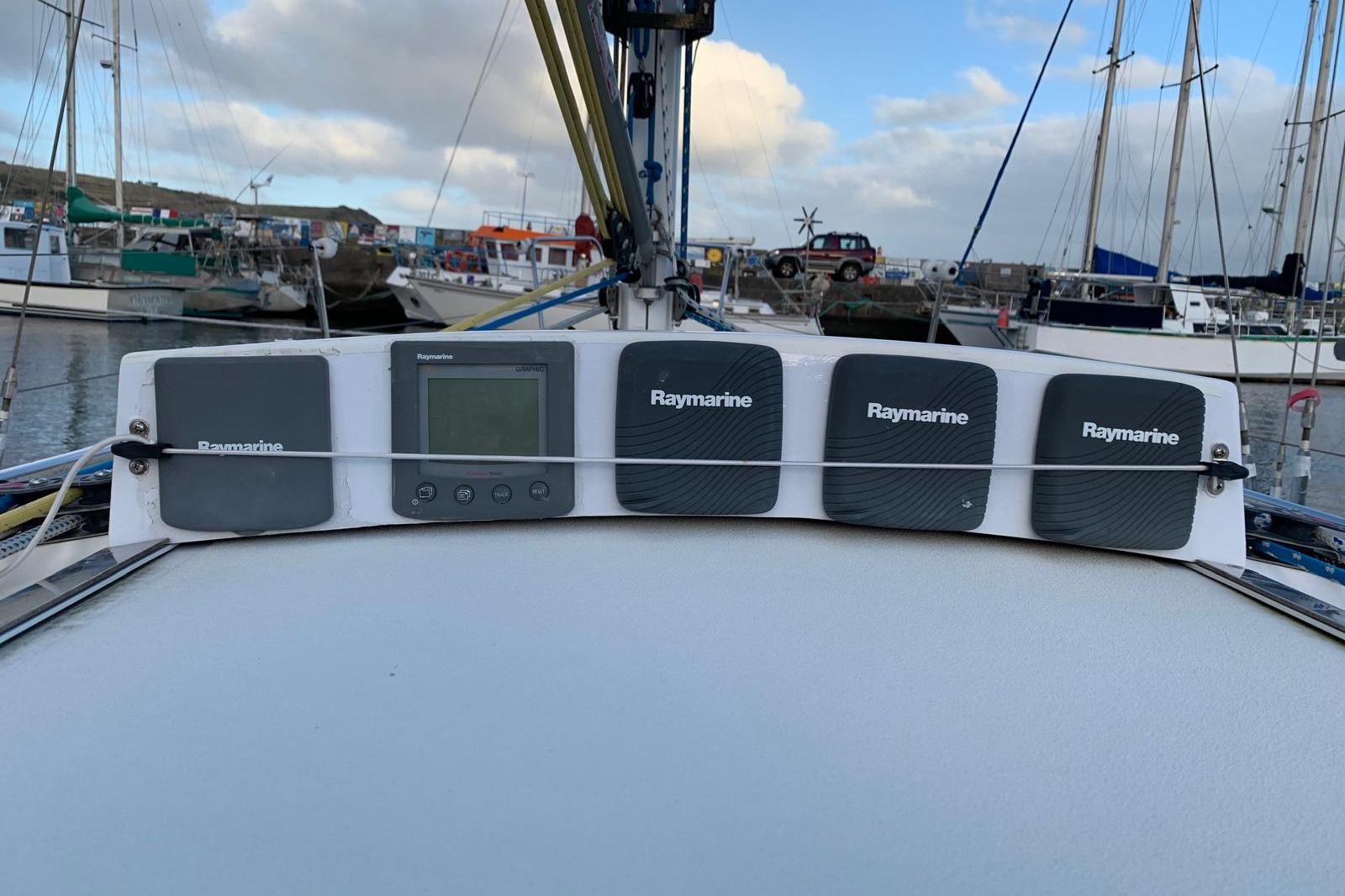 Raymarine instruments on a 2001 J Boats J/105 sailboat in a marina setting.