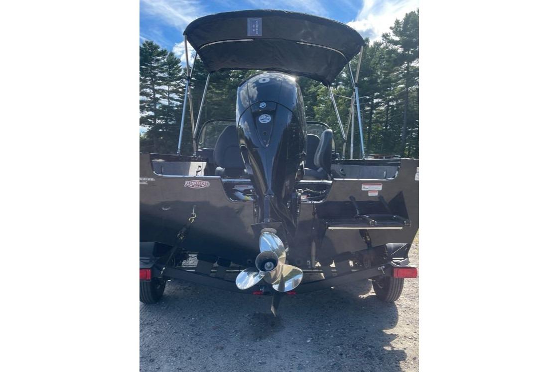 2026 Tracker Targa V-18 WT boat with outboard motor, parked outdoors.