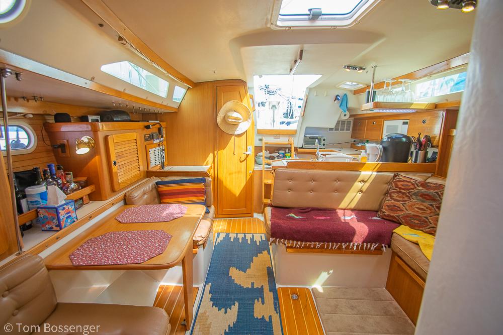 Interior of 2002 Catalina 36 MkII sailboat with cozy seating and dining area.