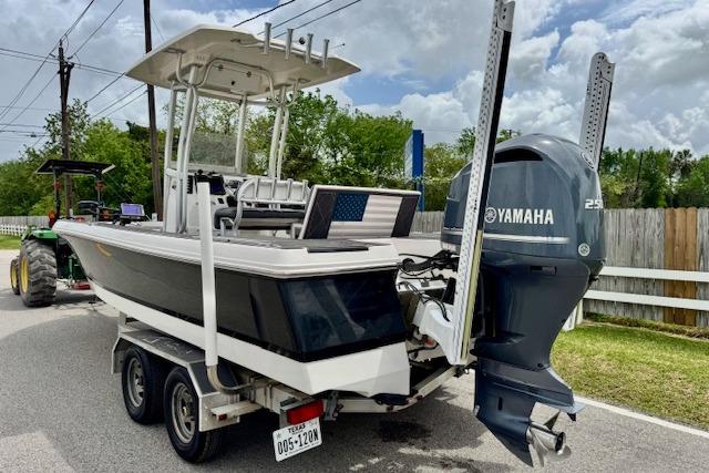 2015 Robalo 226 Cayman boat on trailer with Yamaha 250 engine, parked outdoors.