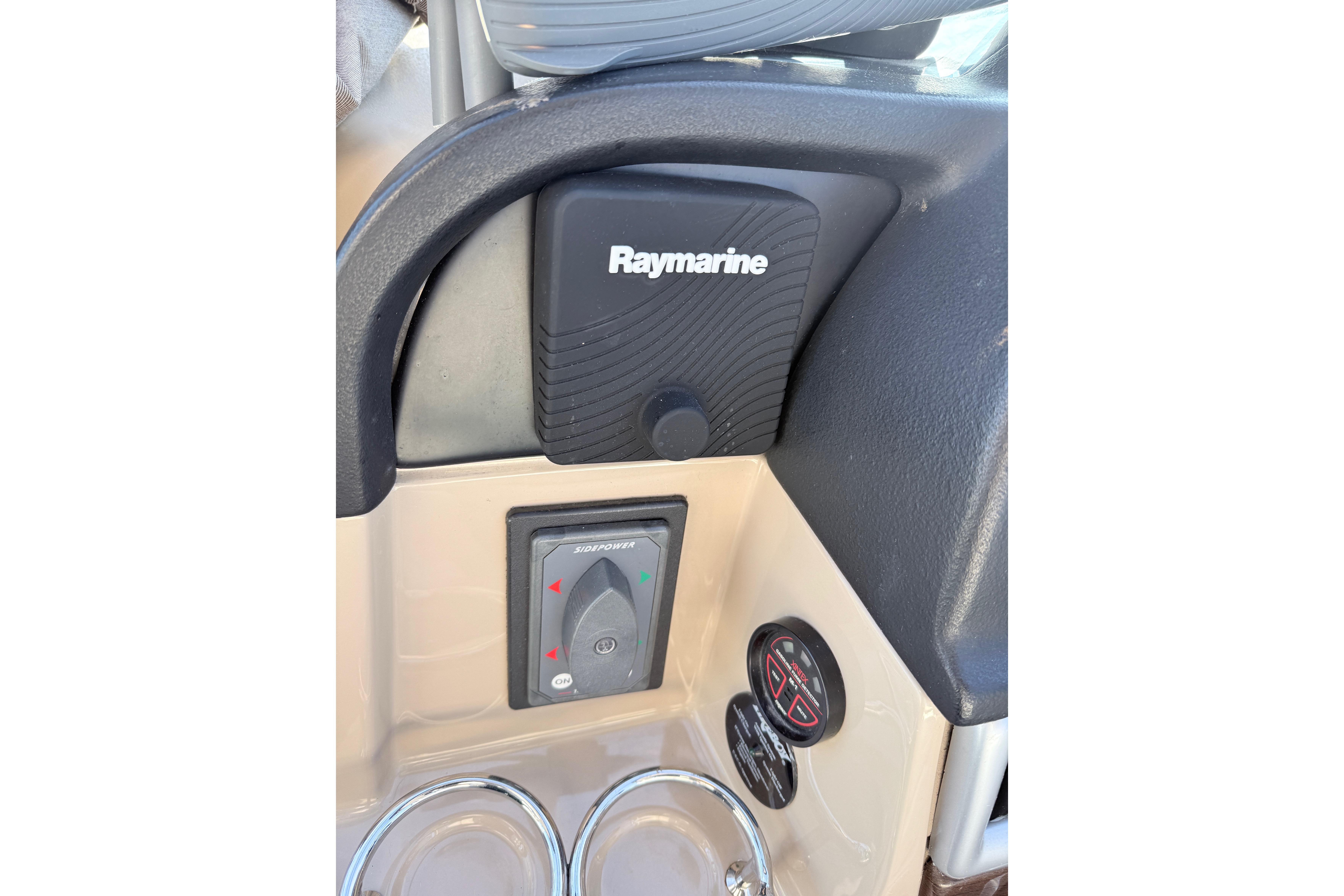 Control panel of 2008 Four Winns V358 boat featuring Raymarine equipment.