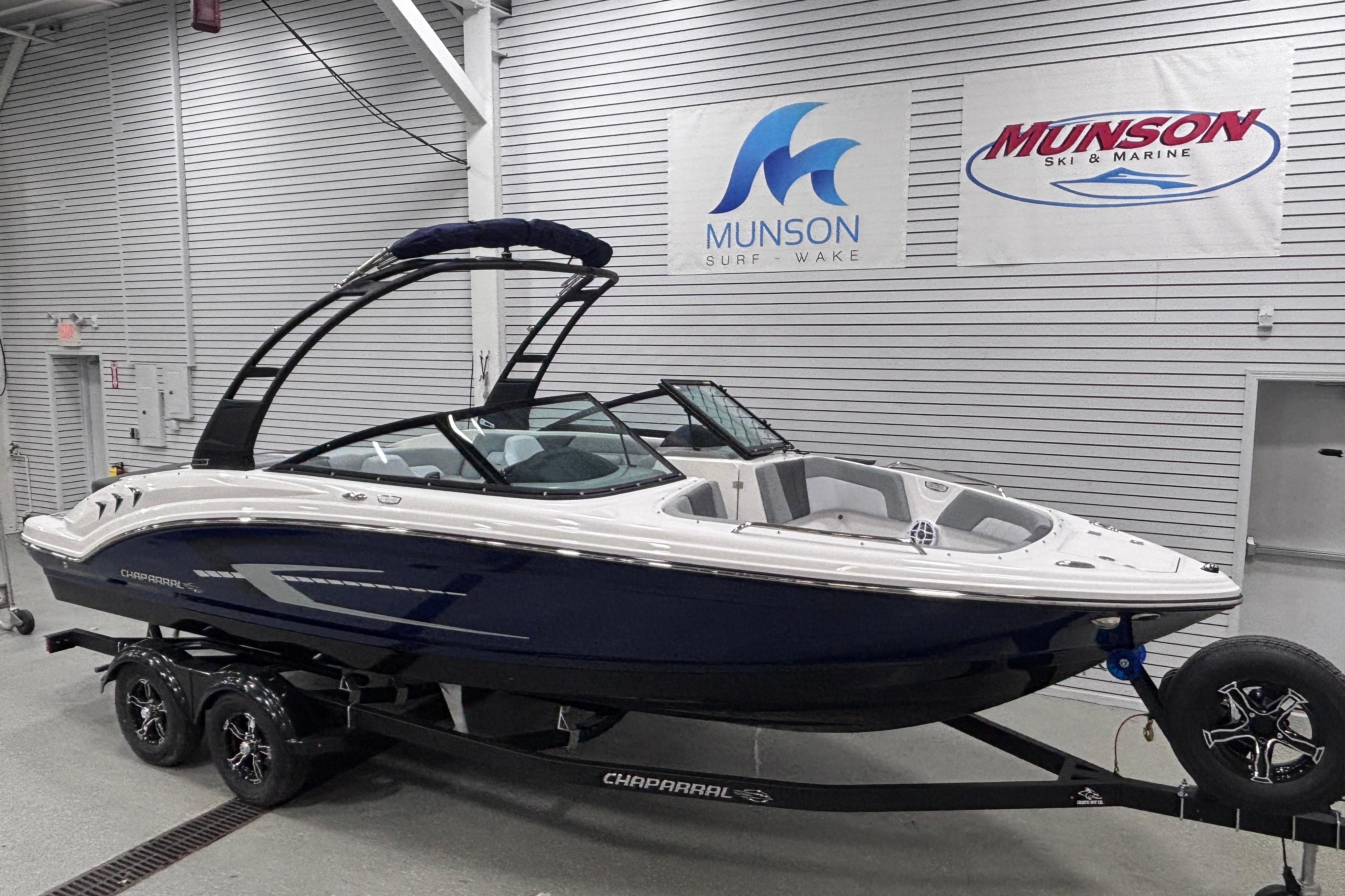 2026 Chaparral 23 SSi boat on trailer in showroom, Munson Ski & Marine.