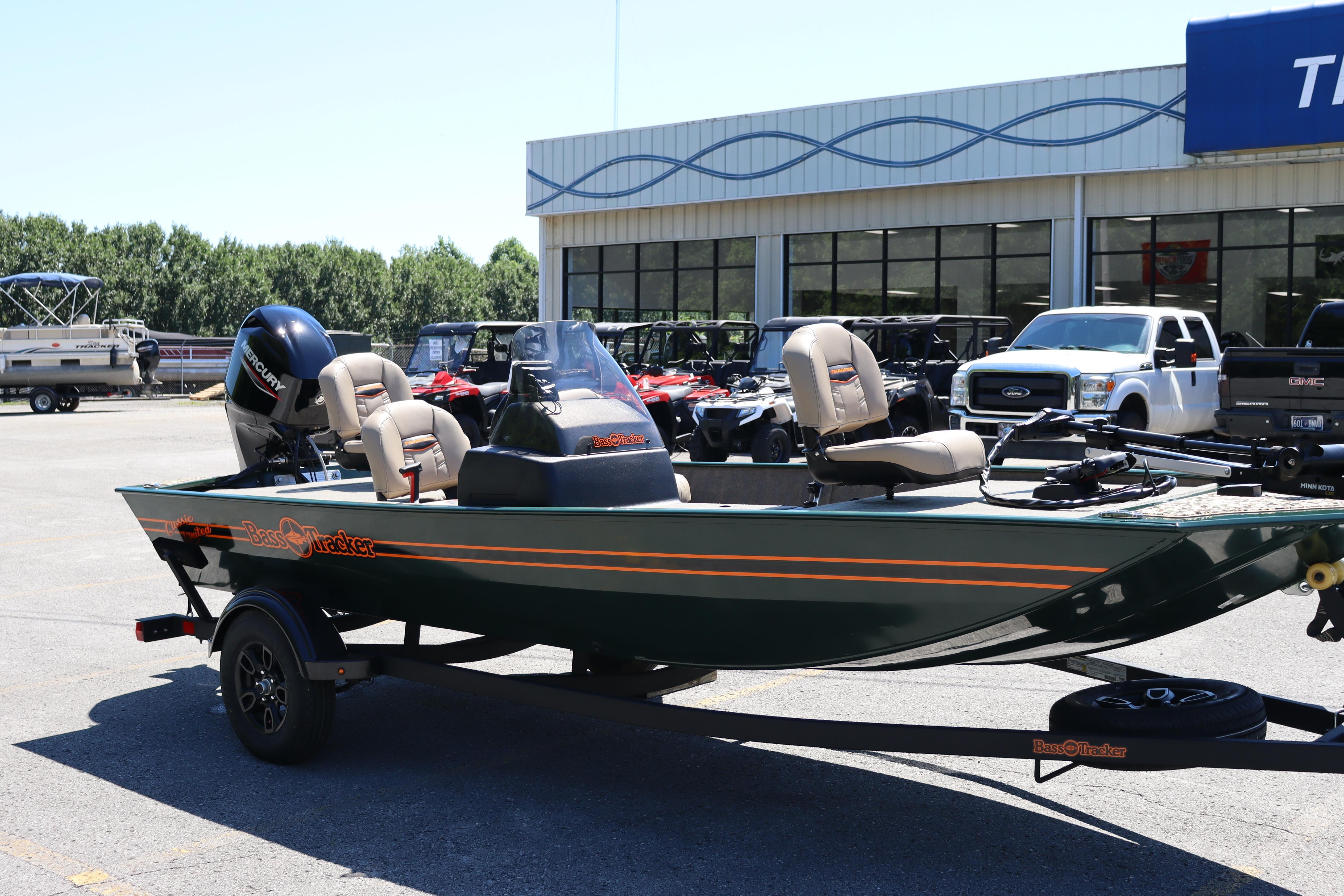 2026 Tracker Bass Tracker Classic Limited boat on trailer at dealership.