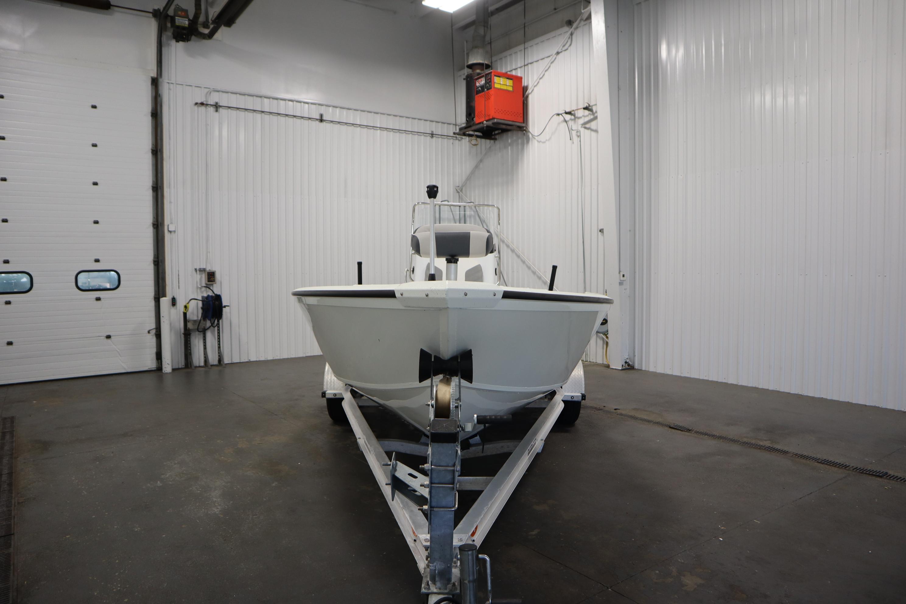 2022 Crestliner 2200 CC boat on trailer in indoor storage facility.