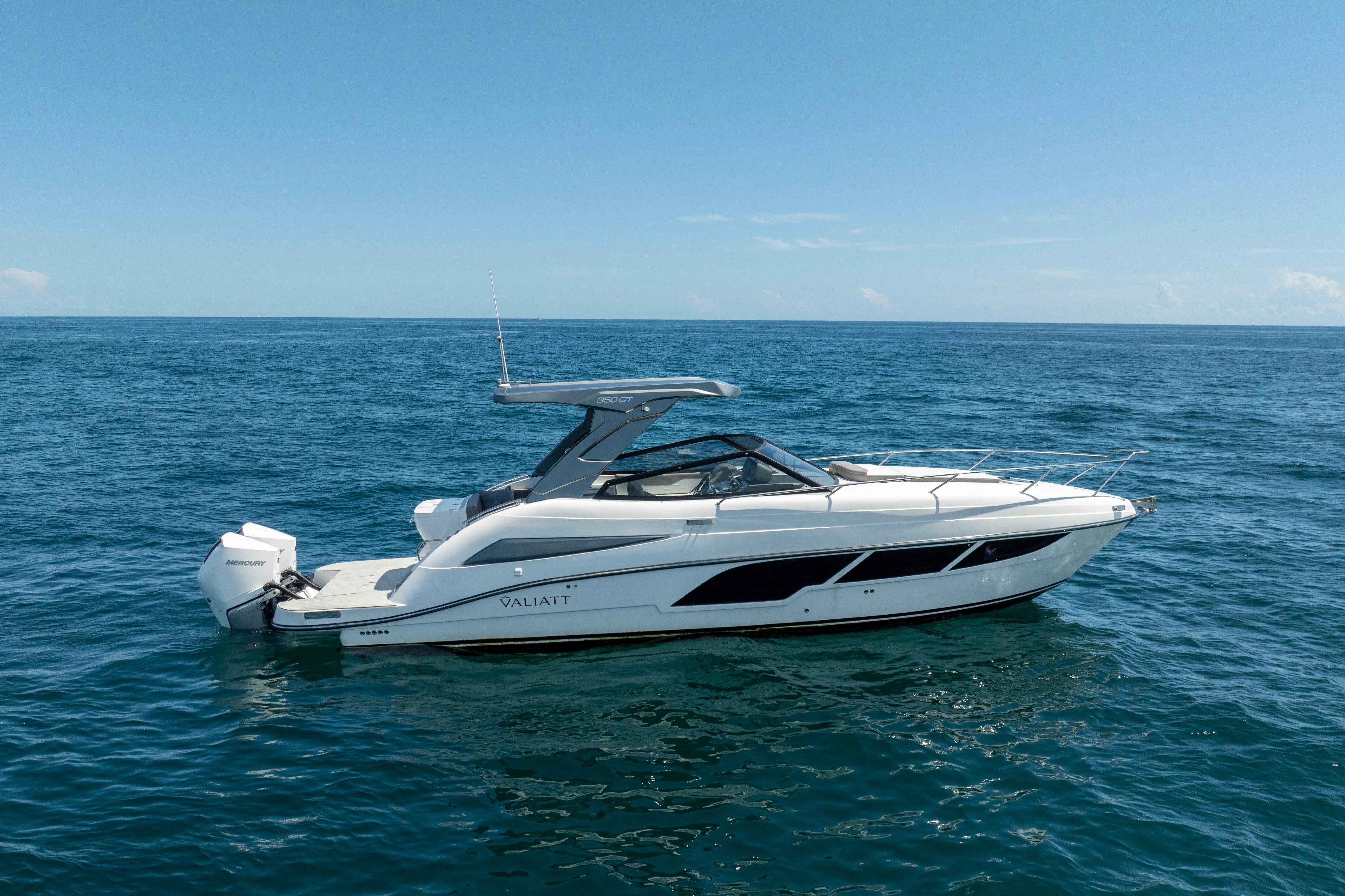 2025 Valiatt 350GT luxury boat cruising on open sea under clear blue sky.