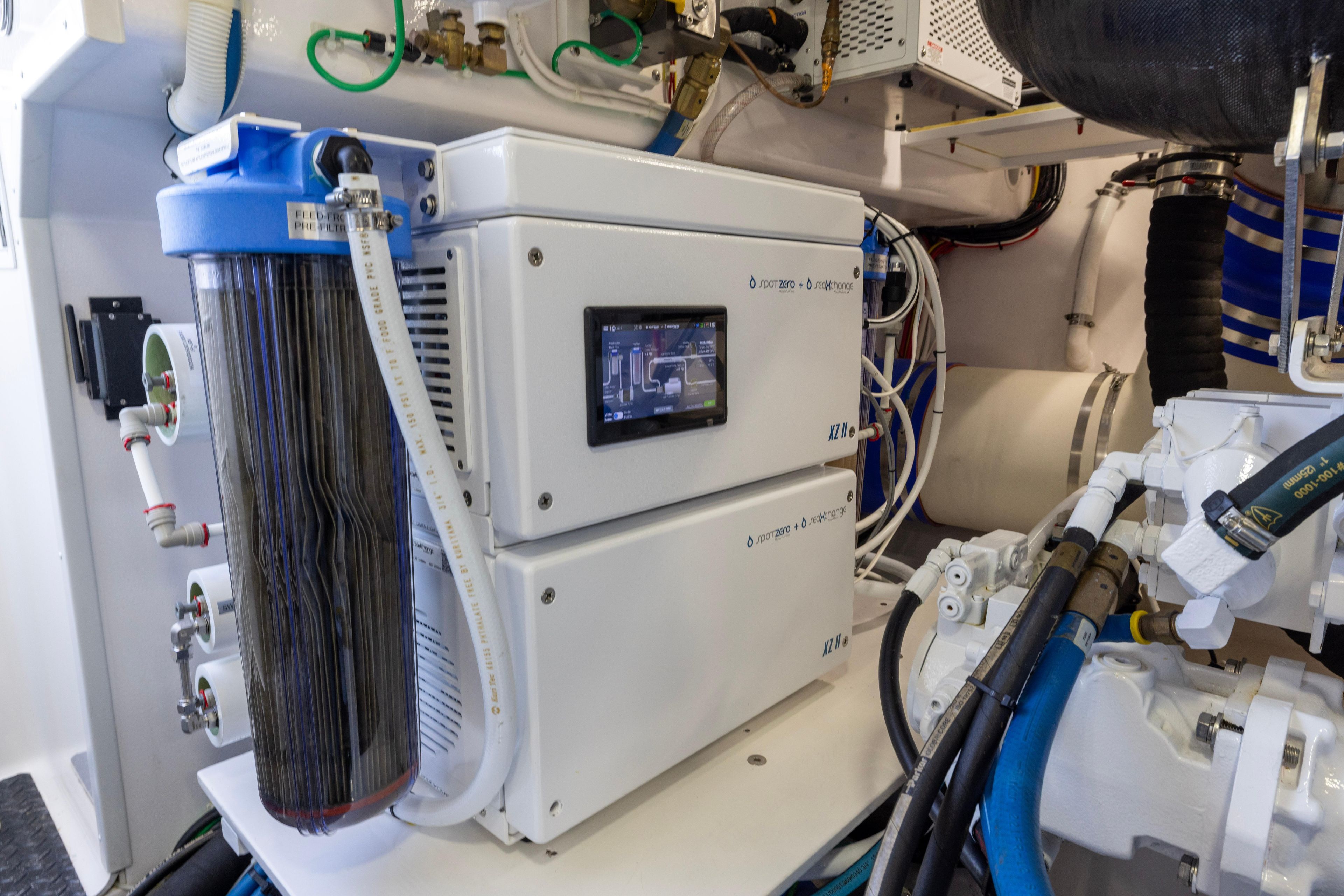 Engine room of 2022 Viking 54 Sport Coupe with advanced filtration system.