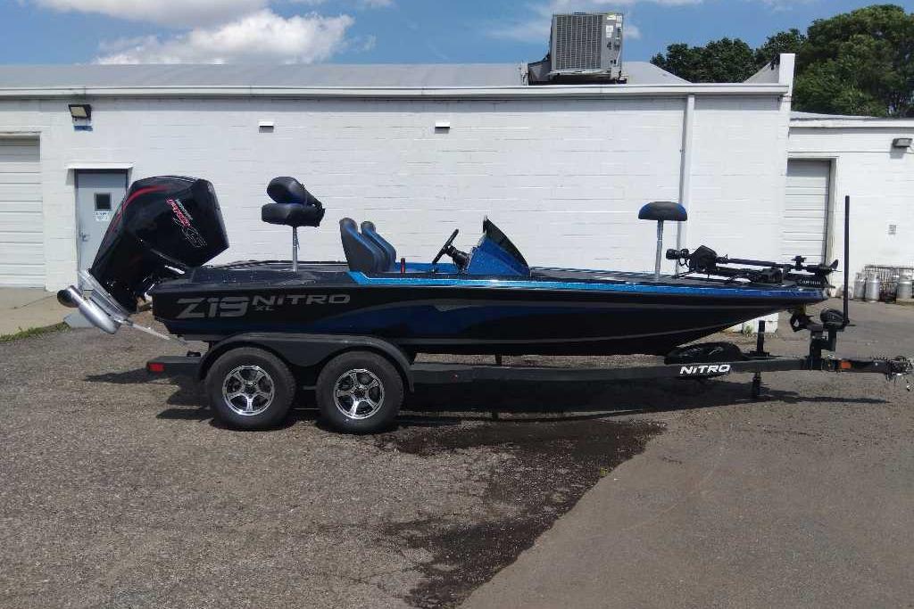2026 Nitro Z19 XL Pro boat on trailer, parked outside a building.