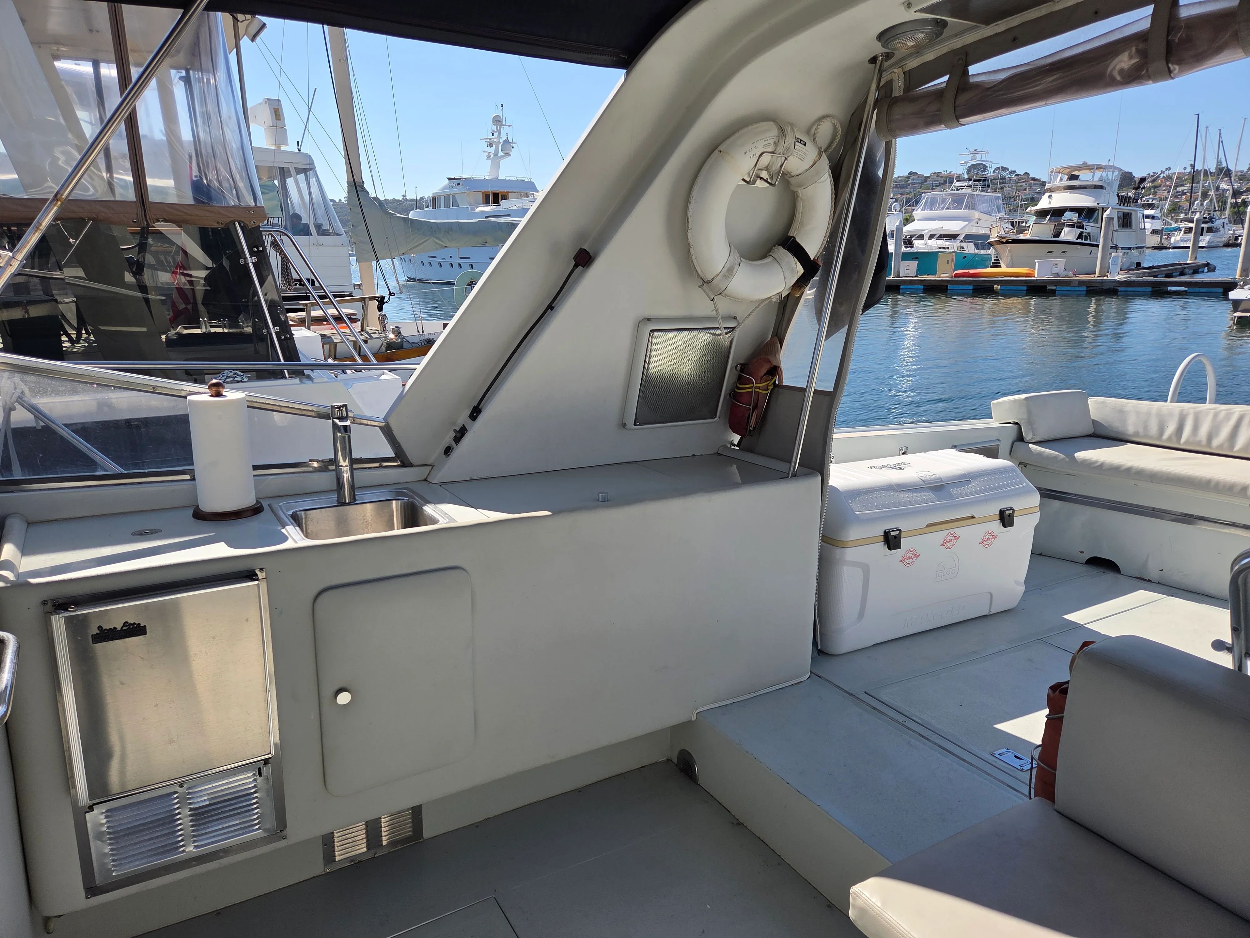 Interior of a 1984 Magnum 53 yacht docked at marina.