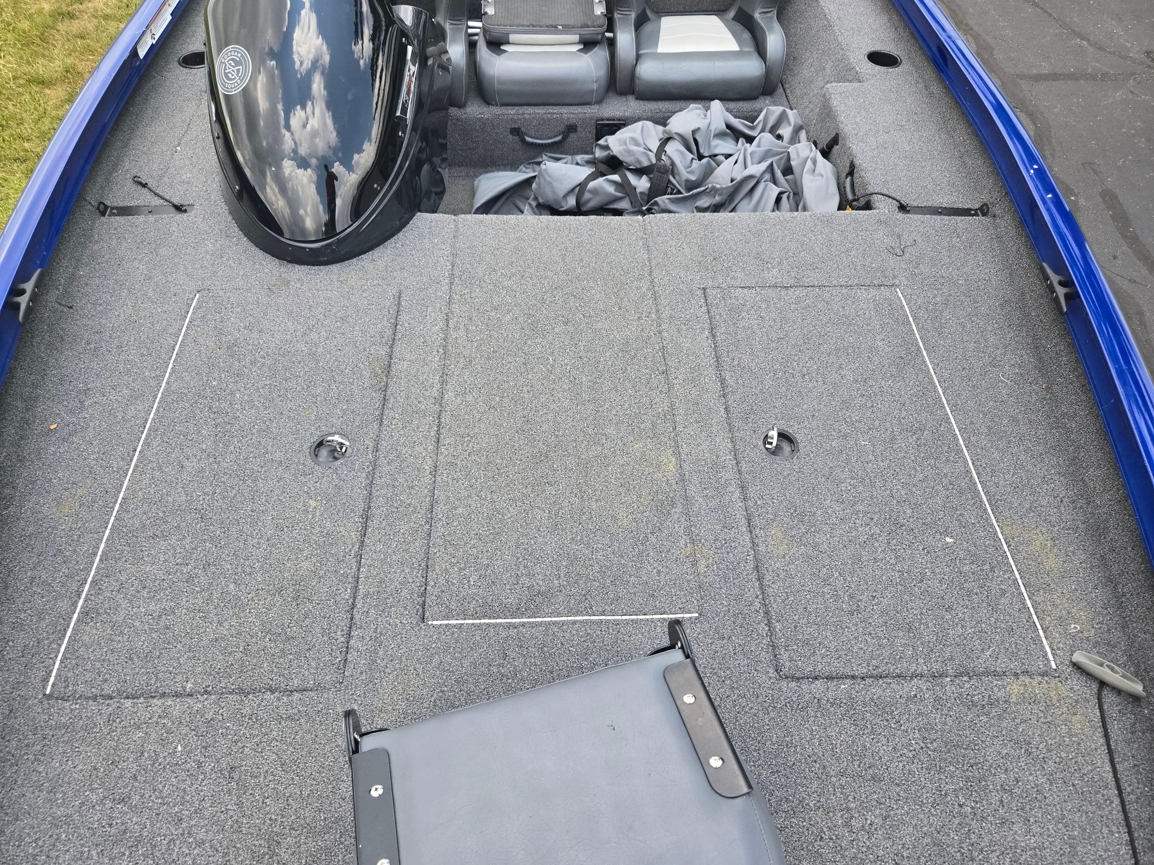 2021 Lowe Stinger 188 boat interior with gray carpet and seating.