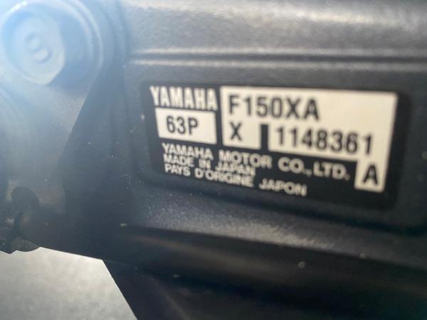 Close-up of a Yamaha engine part with serial number.