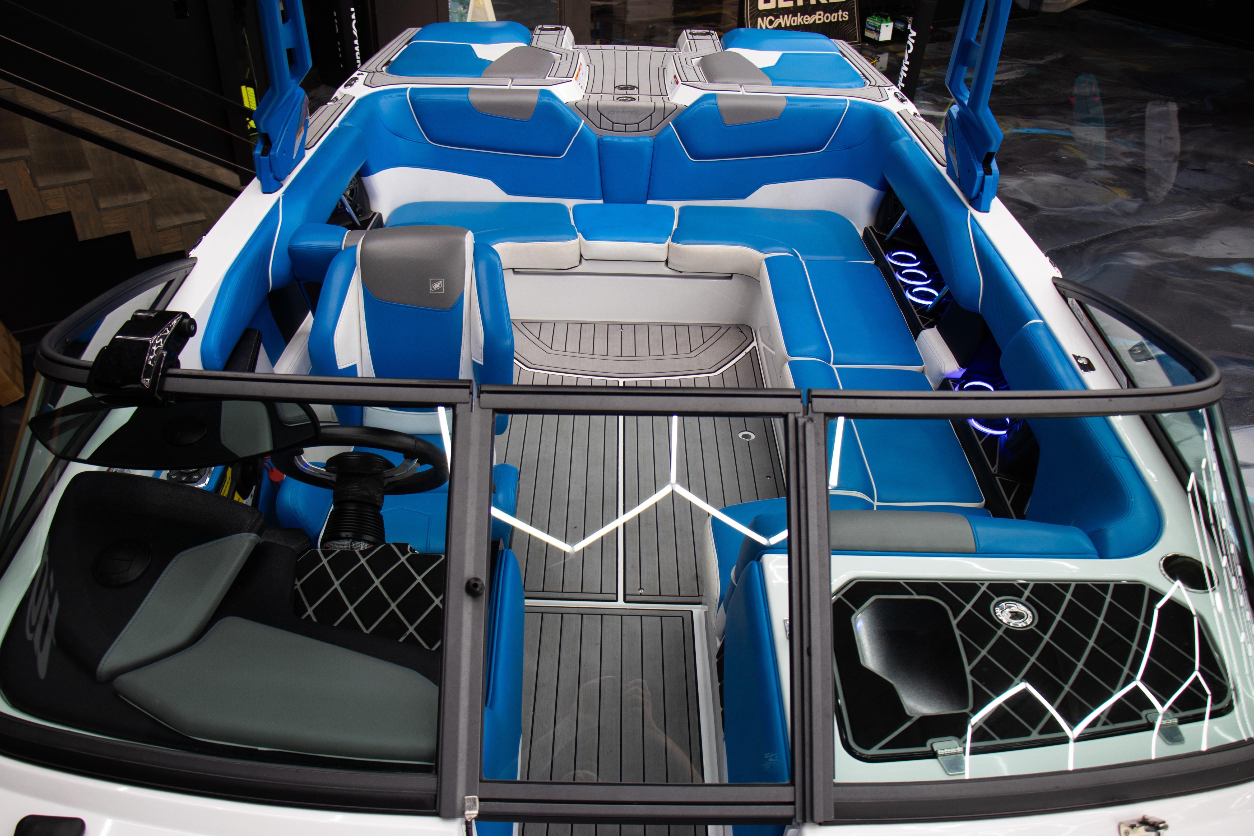 2018 Nautique Super Air Nautique GS22 interior with blue and gray seating, modern design.
