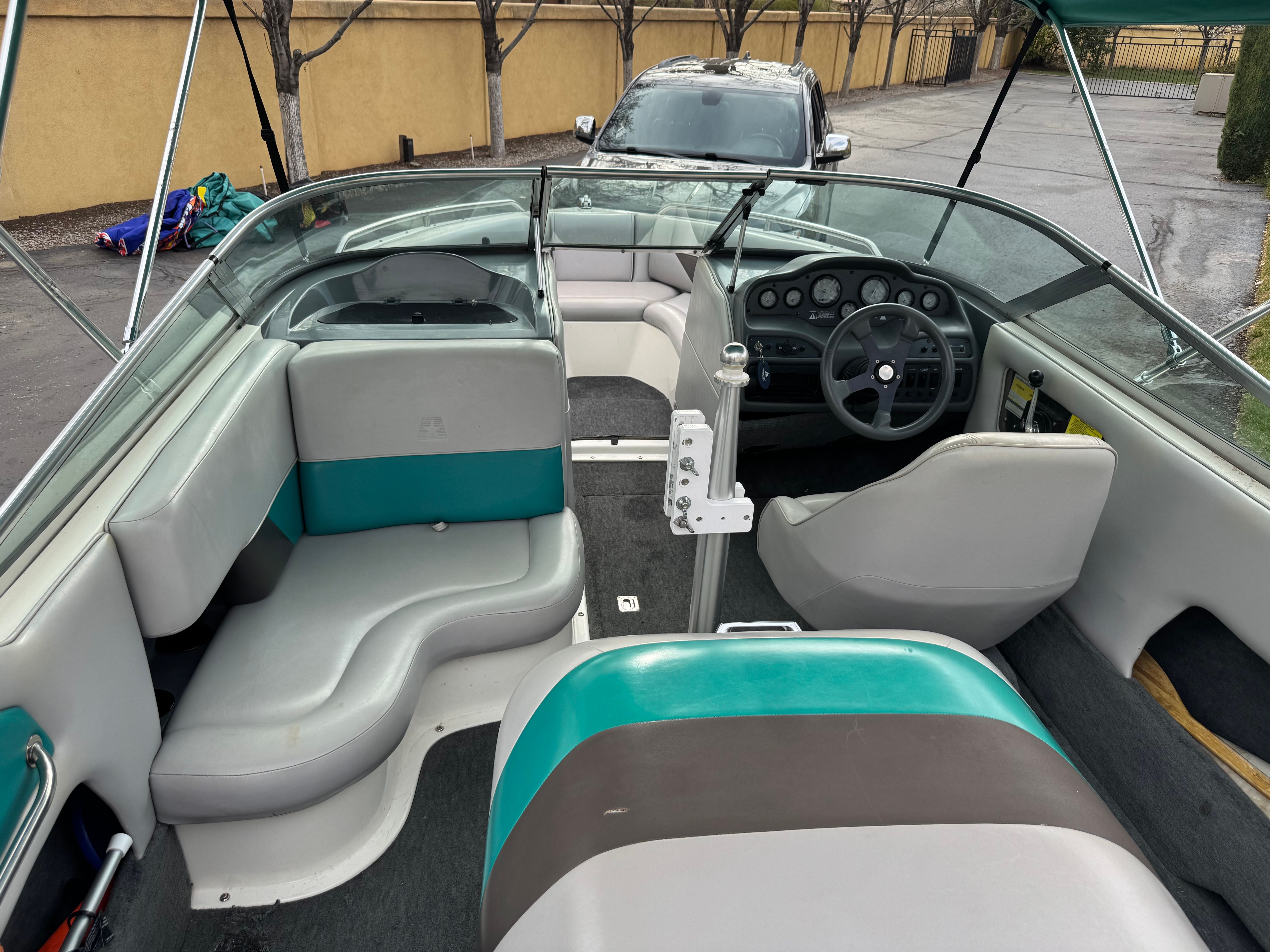 Interior of a 1993 MasterCraft Maristar boat with gray and teal seating.