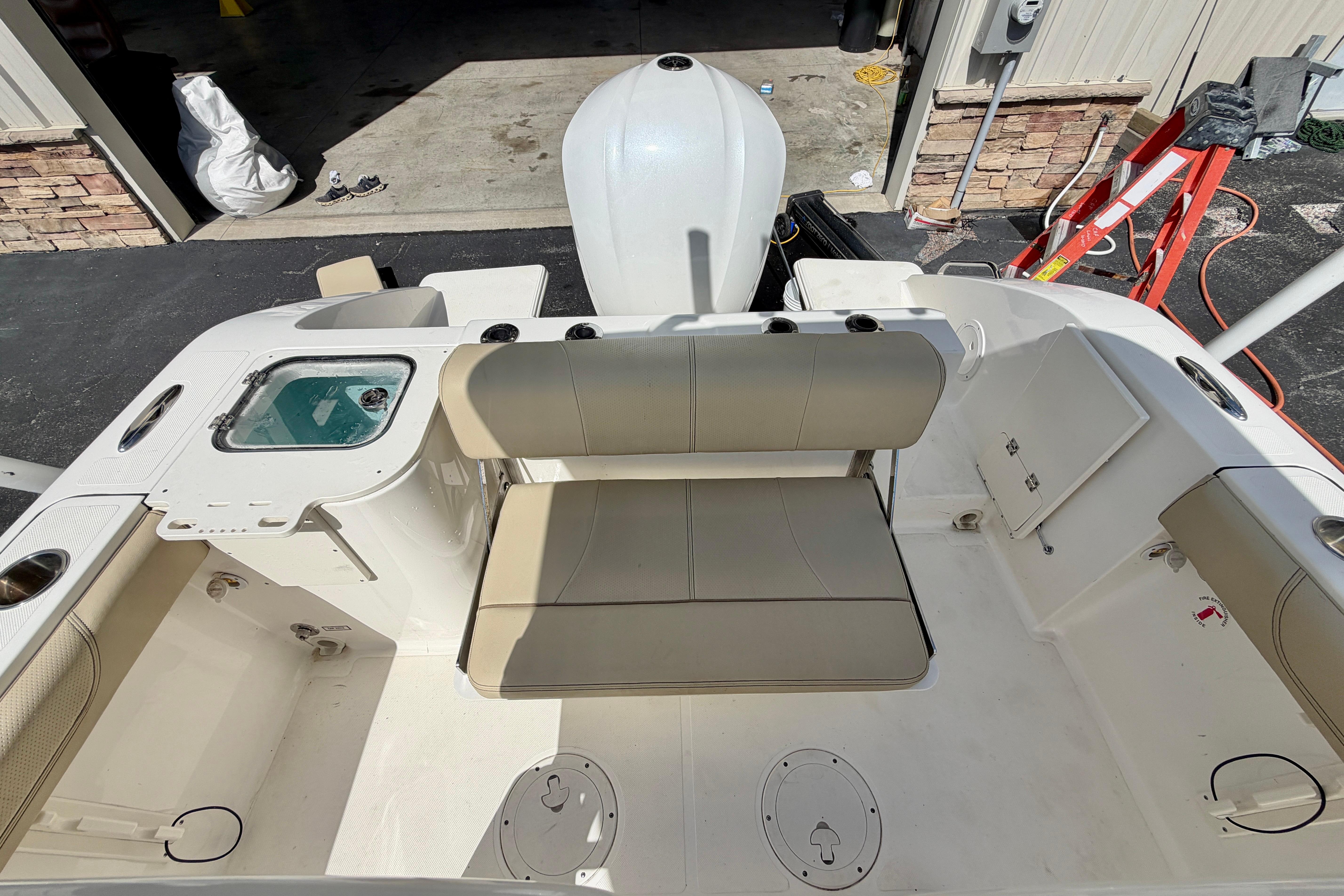 2020 Pursuit C 238 Center Console boat interior with seating and storage compartments.