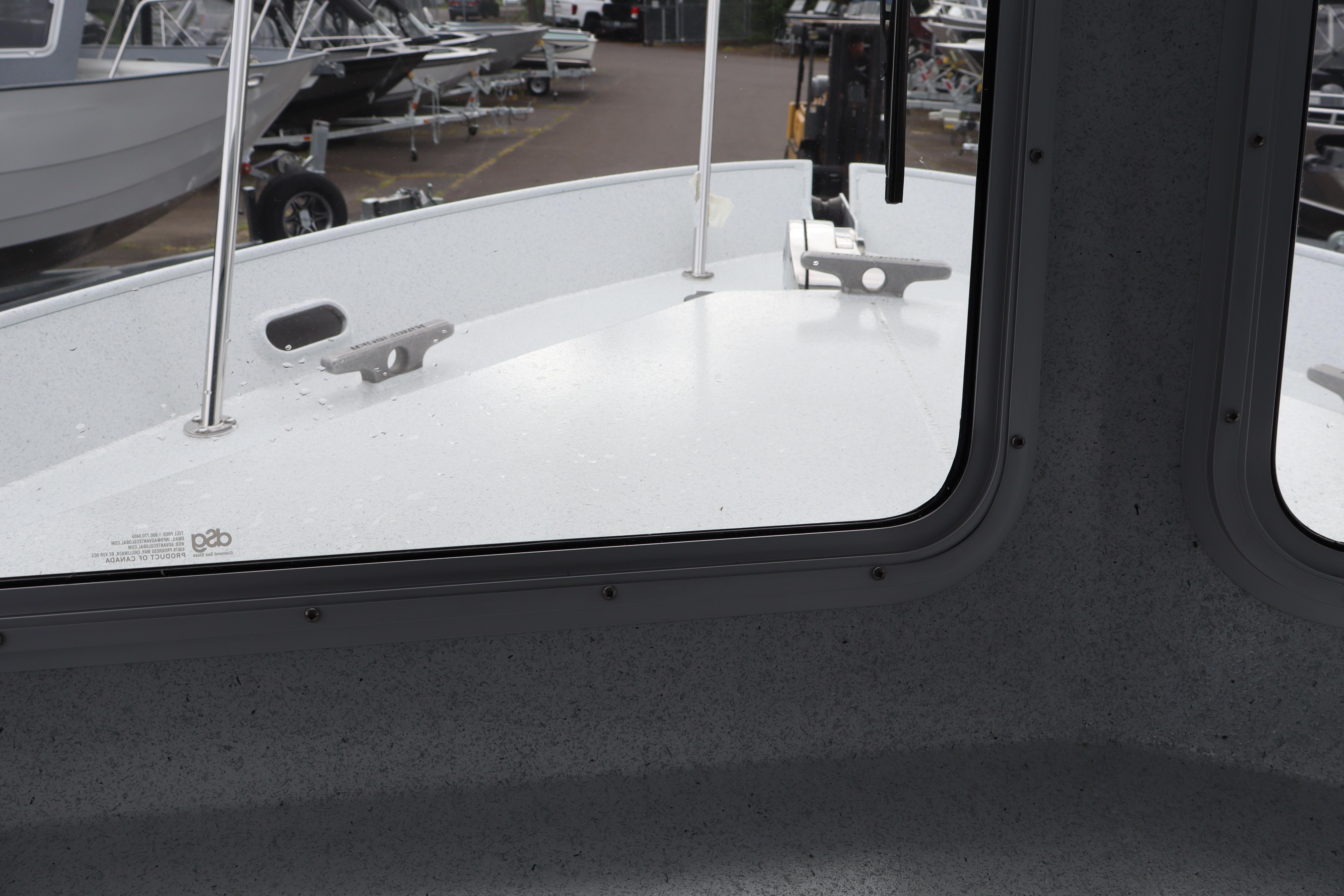 Interior view of 2026 KingFisher 2825 Coastal Express boat through window.