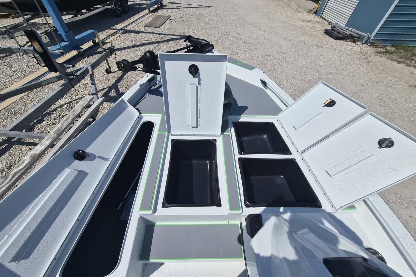 Open storage compartments on a 2026 Xpress H18 boat deck.