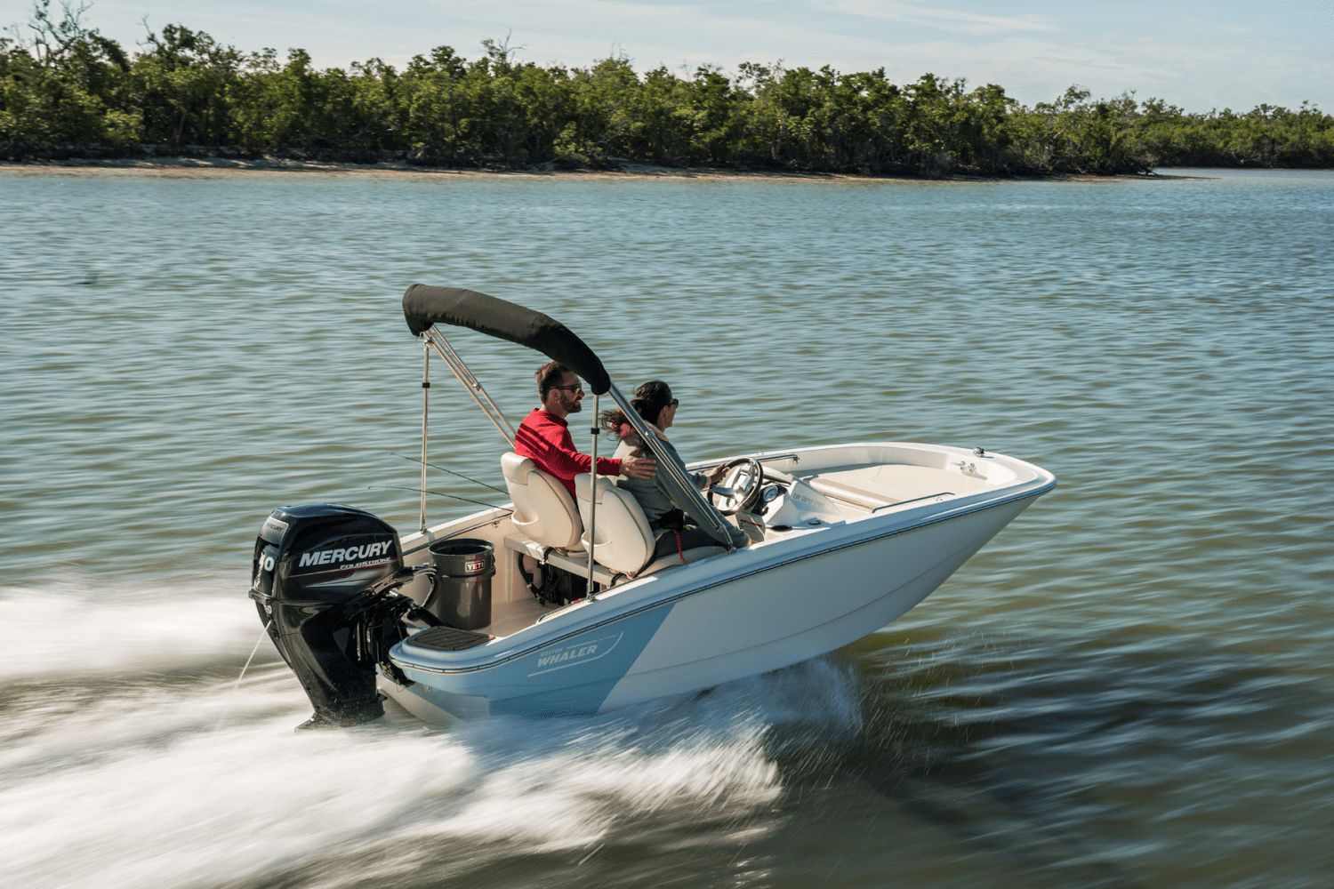 A 2026 Boston Whaler 130 Super Sport speeding across the water.