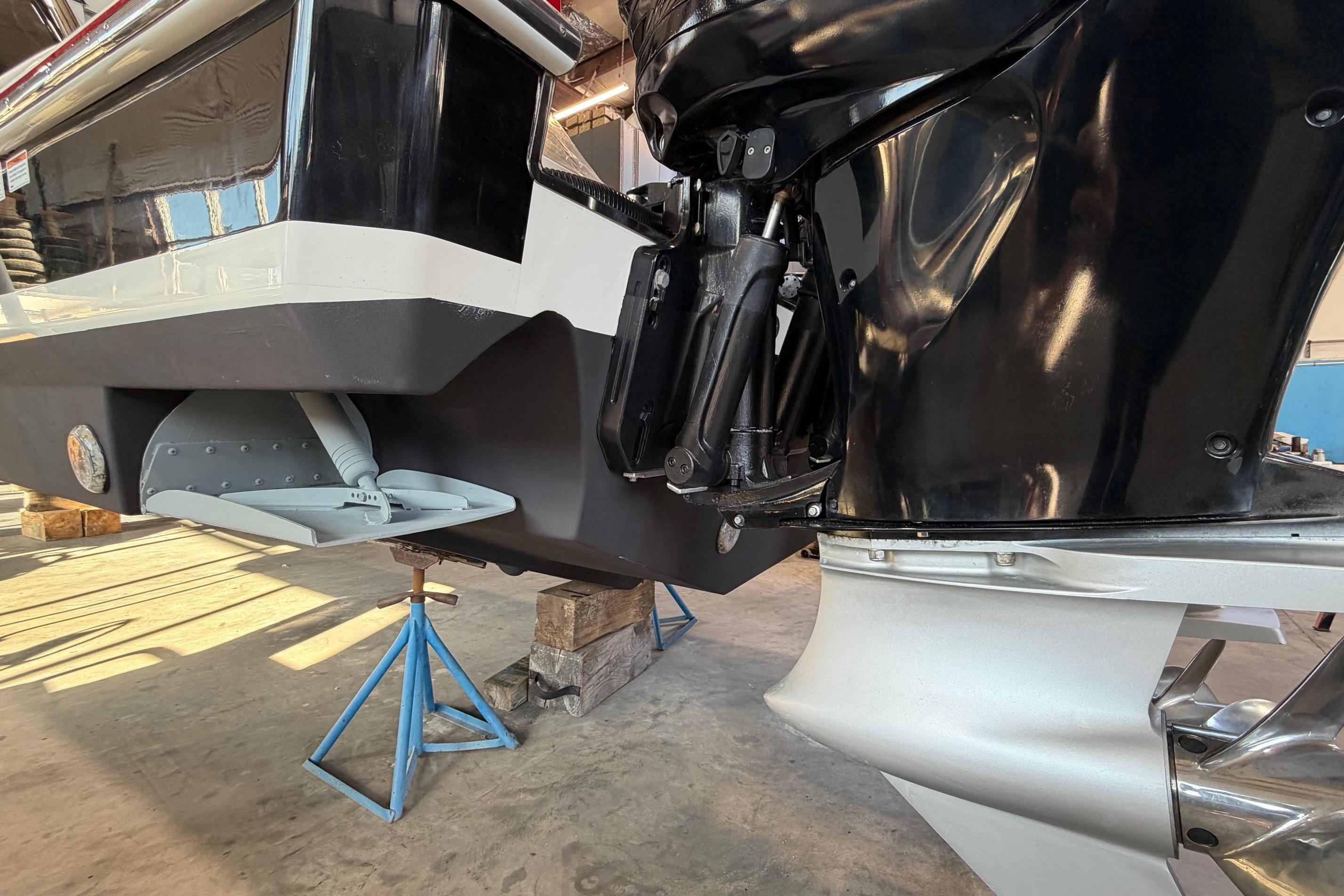 2017 Formula 430 Super Sport Crossover boat engine detail in a workshop setting.