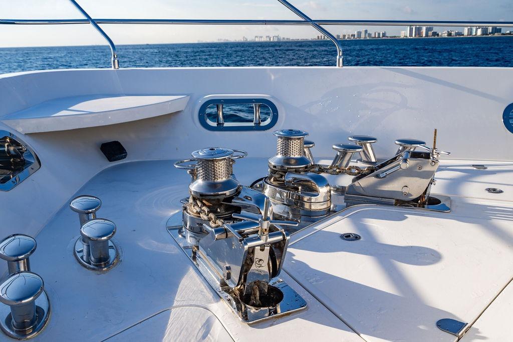 Deck view of 2010 Princess 95 Motor Yacht with winches and ocean backdrop.