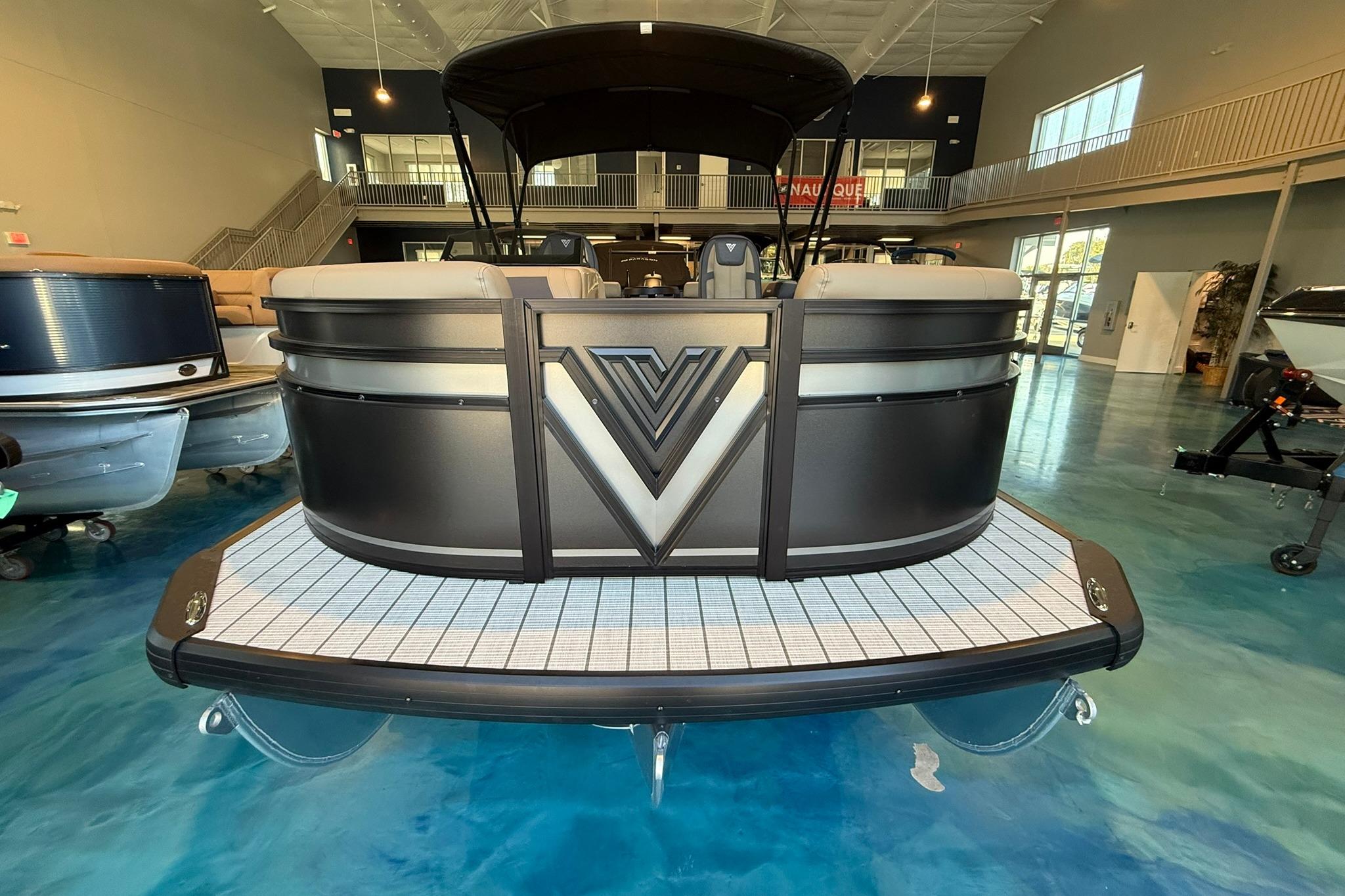 2026 Viaggio Lago V-U 20 pontoon boat in showroom, featuring sleek design and modern amenities.