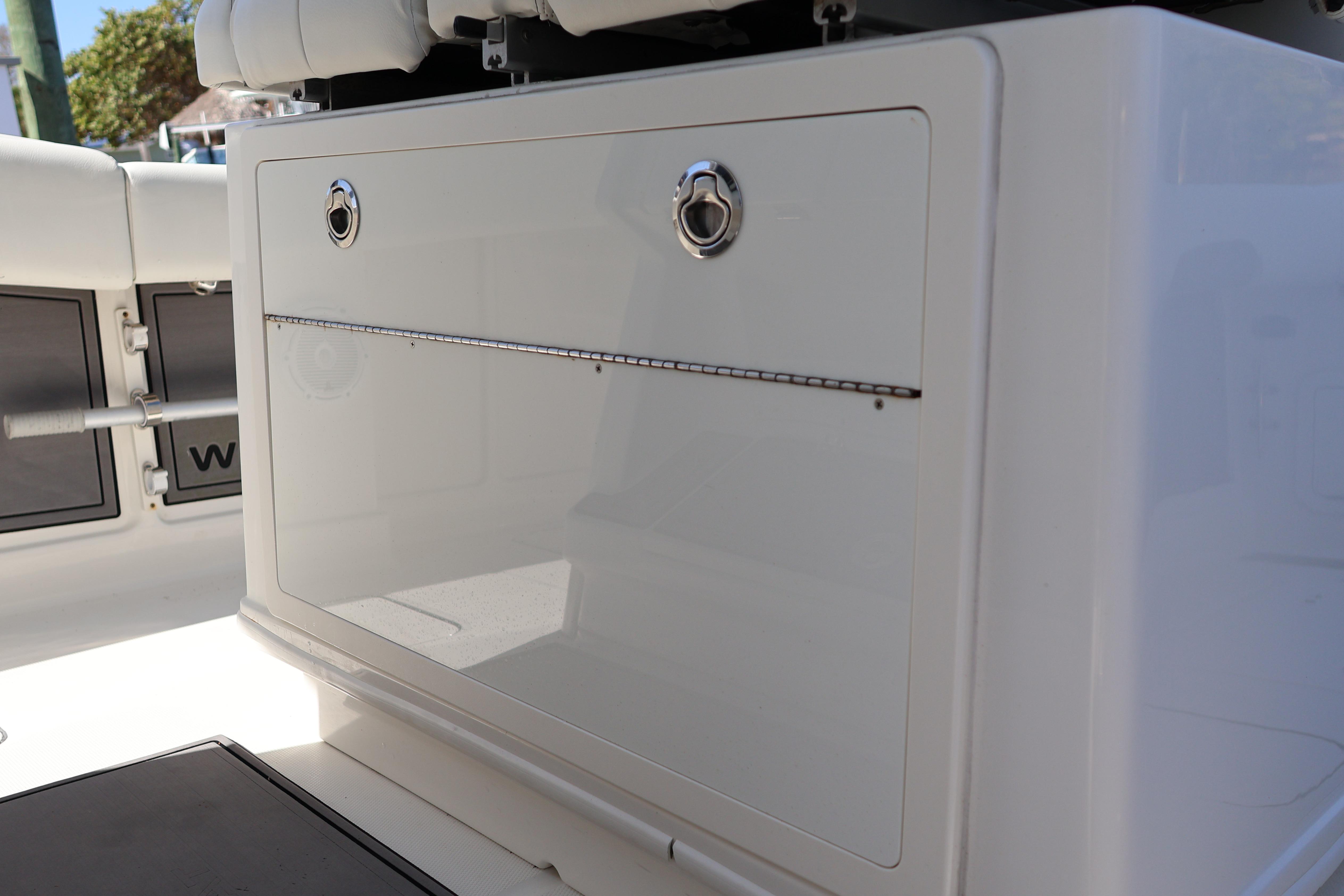 2022 World Cat 280 CC-X boat storage compartment with sleek design and secure latches.