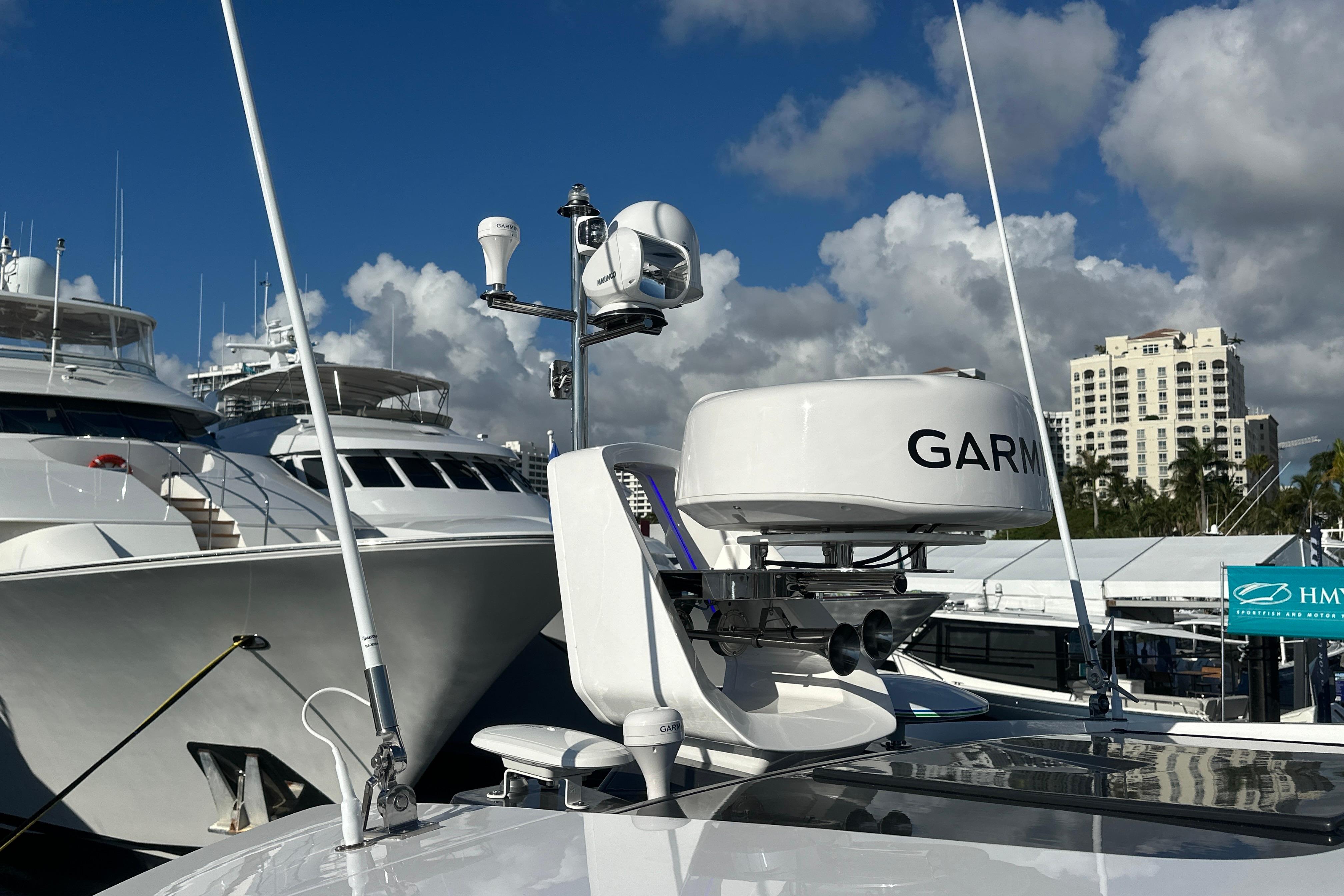 2026 Fairline Targa 47 GT yacht with Garmin radar, docked under a blue sky.