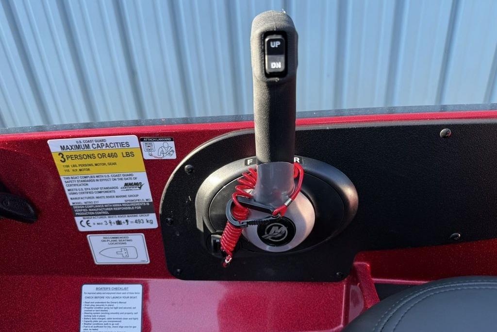 Throttle control of 2026 Nitro Z17 boat with capacity label, red safety lanyard attached.