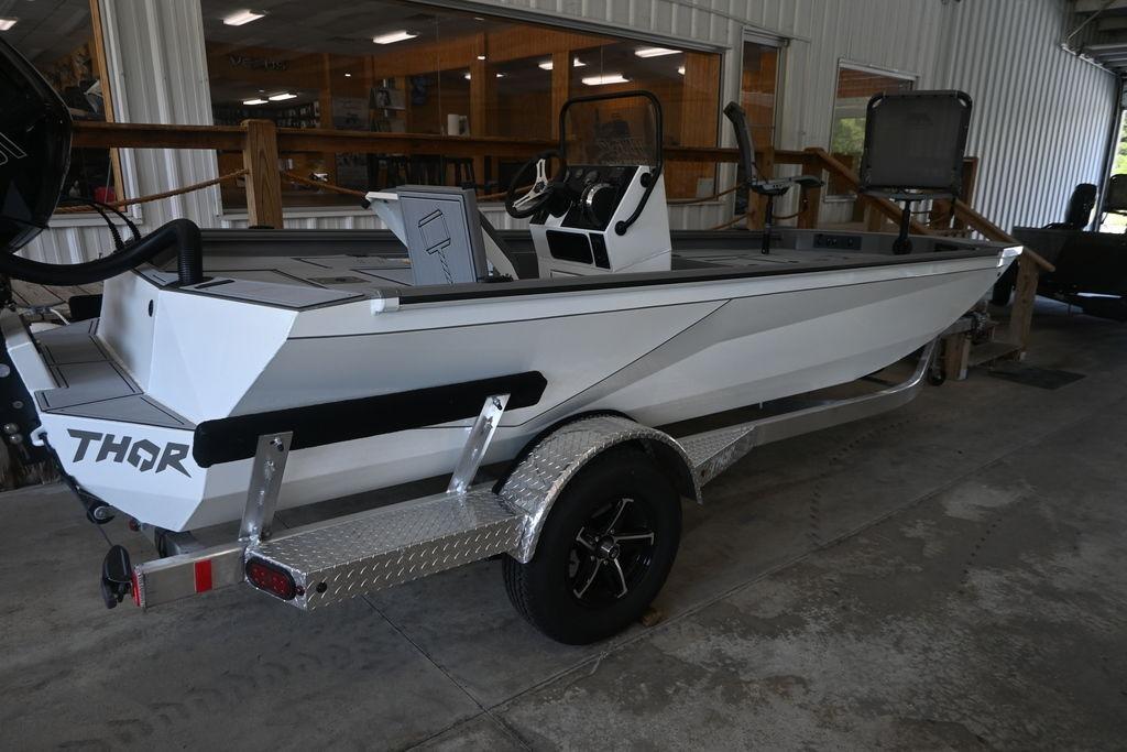 2026 Thor Lake Hammer 1900CC boat on trailer in showroom.