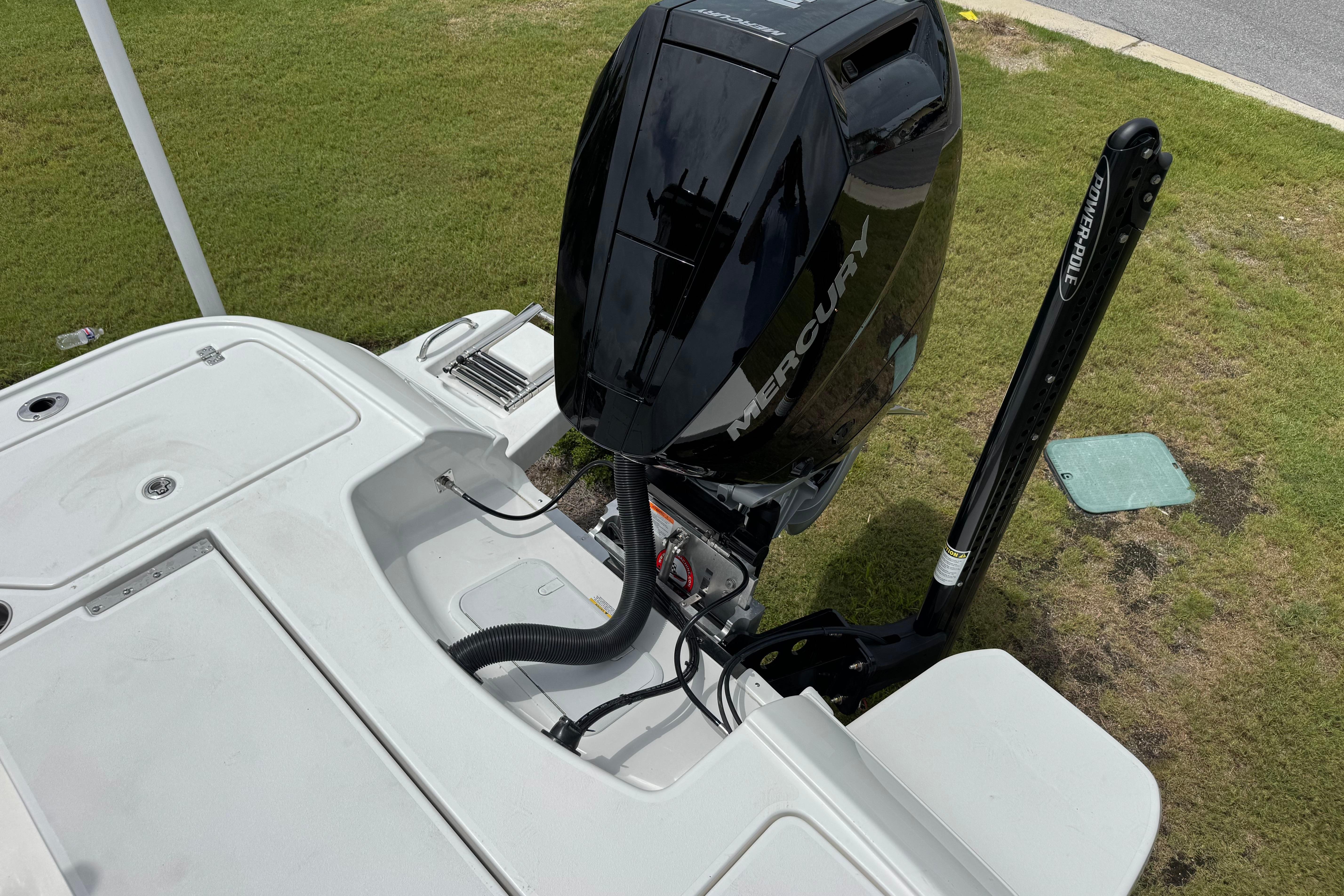 2027 Caymas 26 HB boat with Mercury outboard motor and Power-Pole anchor system.